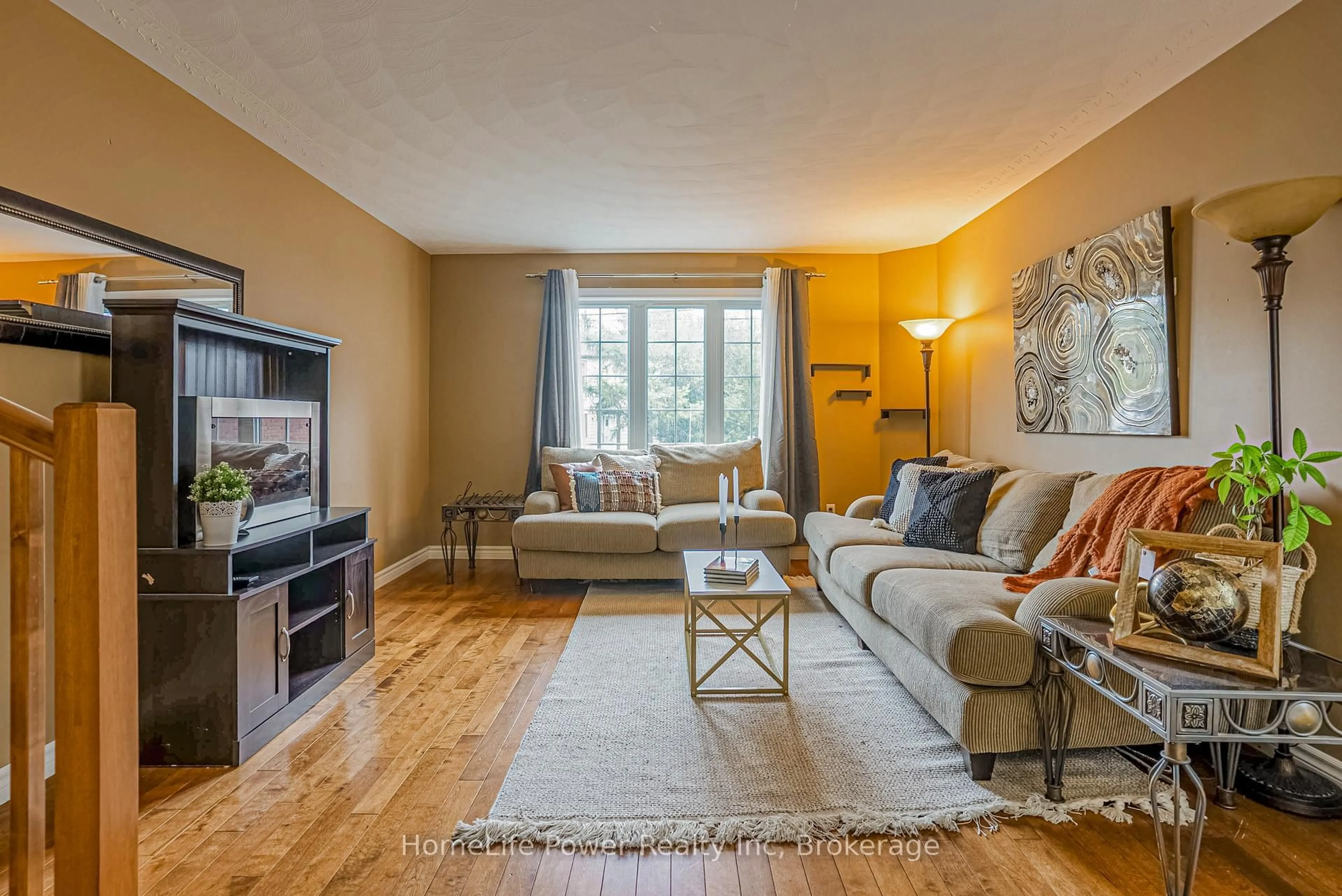 Living room with furniture, wood/laminate floor for 8 Copper St #B, Greater Sudbury Ontario P3E 2C2