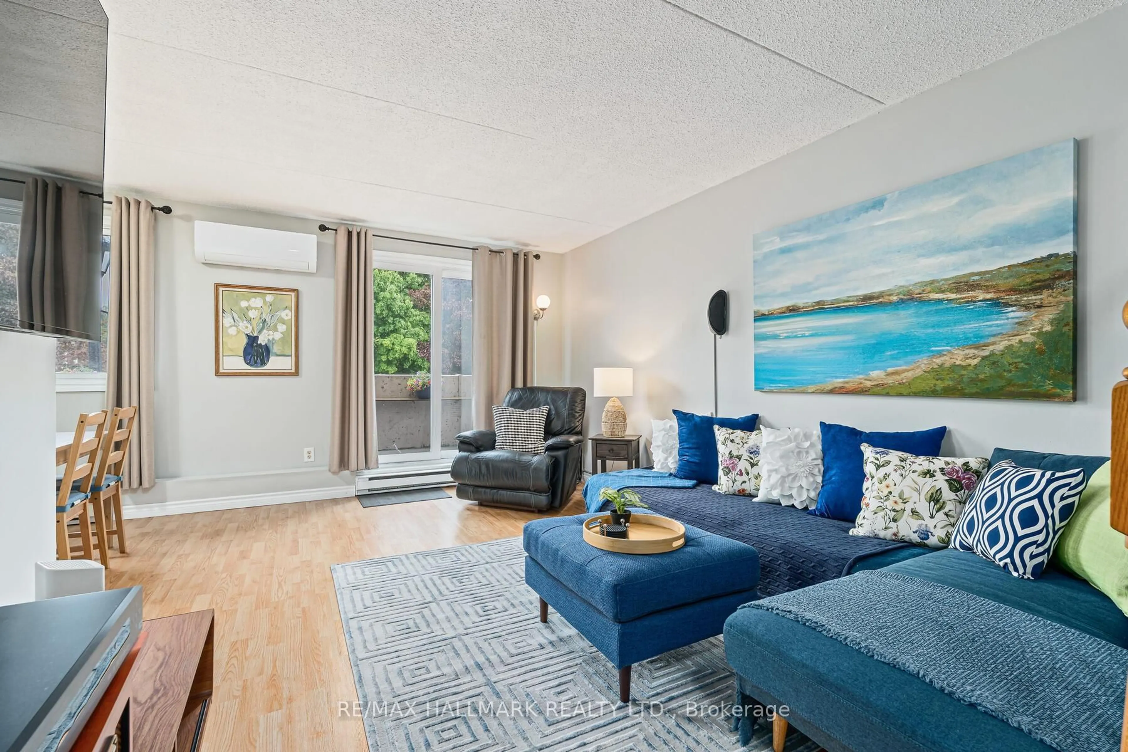 Living room with furniture, wood/laminate floor for 42 Tannery St #236, Cambridge Ontario N3C 2B9