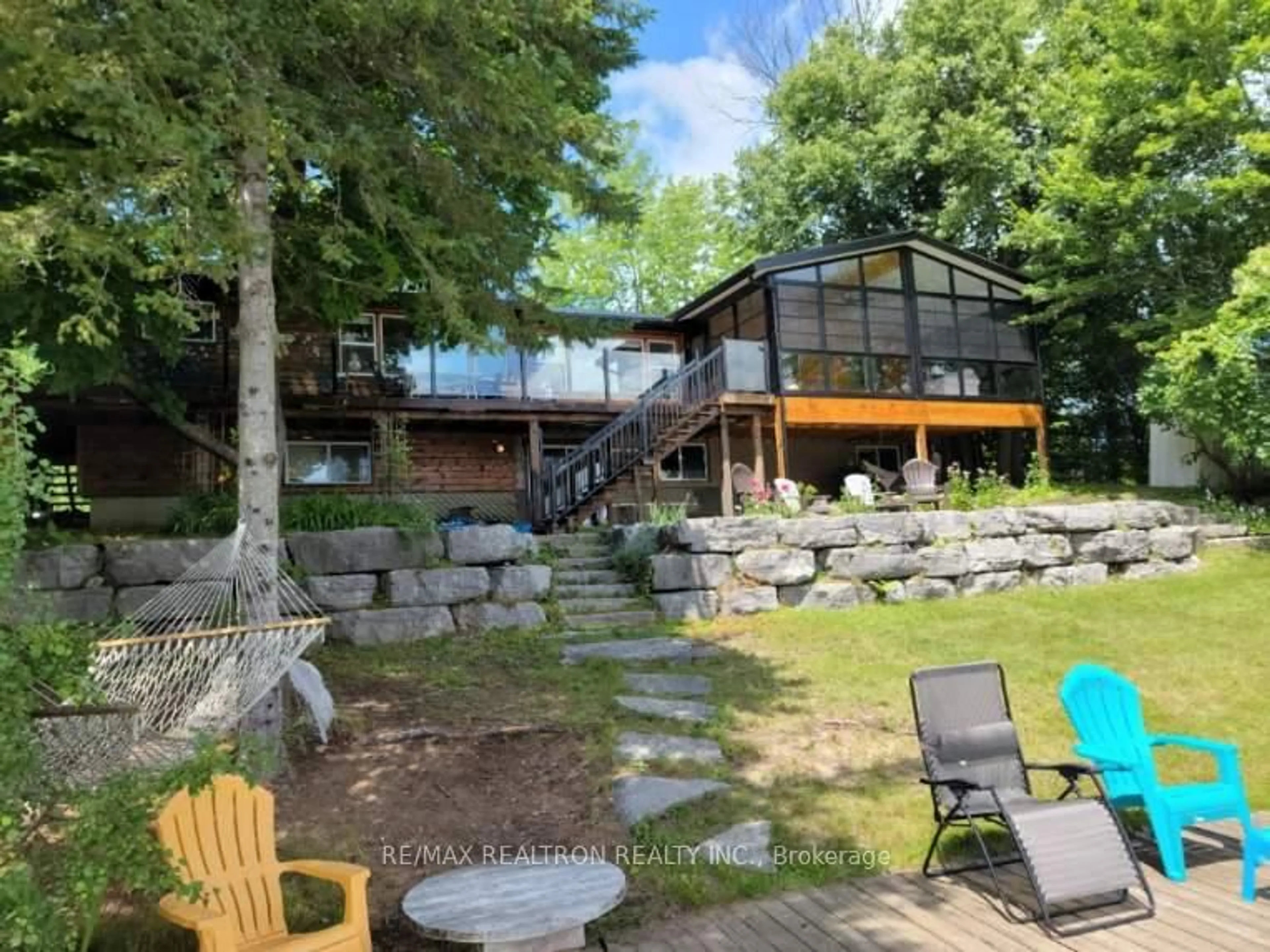 A pic from outside/outdoor area/front of a property/back of a property/a pic from drone, water/lake/river/ocean view for 103 Peninsula Dr, Trent Lakes Ontario K0M 1A0