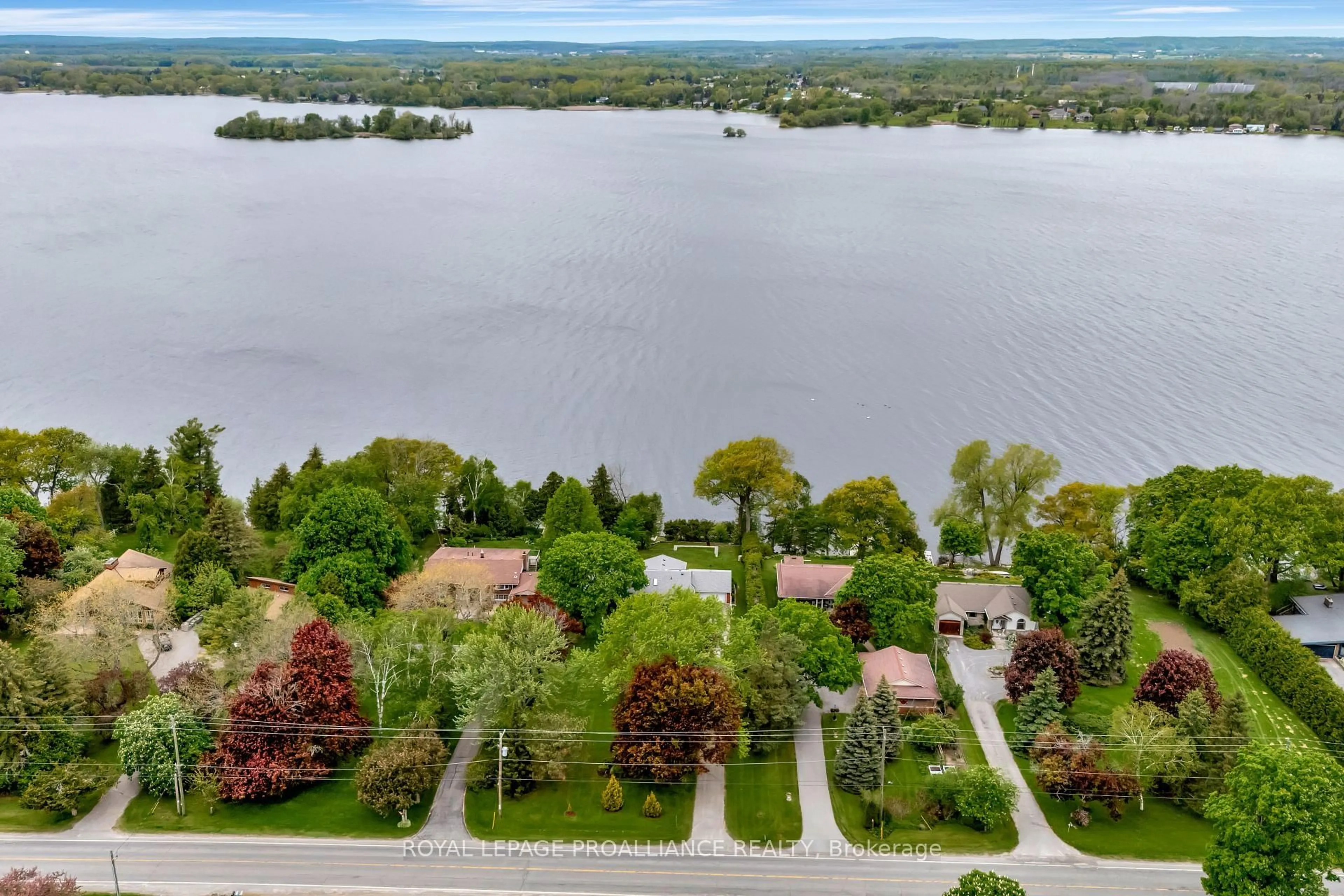 A pic from outside/outdoor area/front of a property/back of a property/a pic from drone, water/lake/river/ocean view for 1826 County Rd 3 Rd, Prince Edward County Ontario K0K 1L0