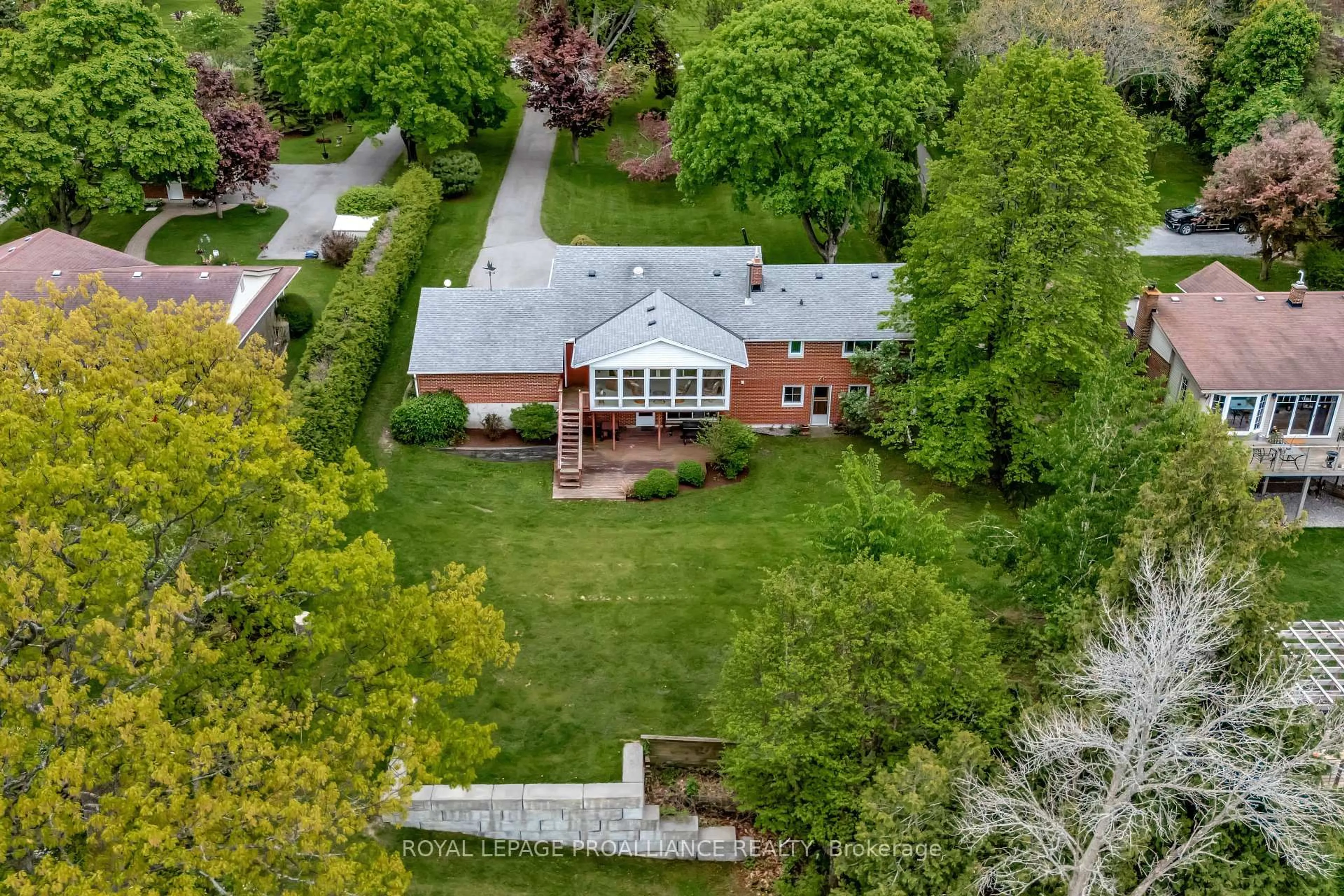A pic from outside/outdoor area/front of a property/back of a property/a pic from drone, street for 1826 County Rd 3 Rd, Prince Edward County Ontario K0K 1L0