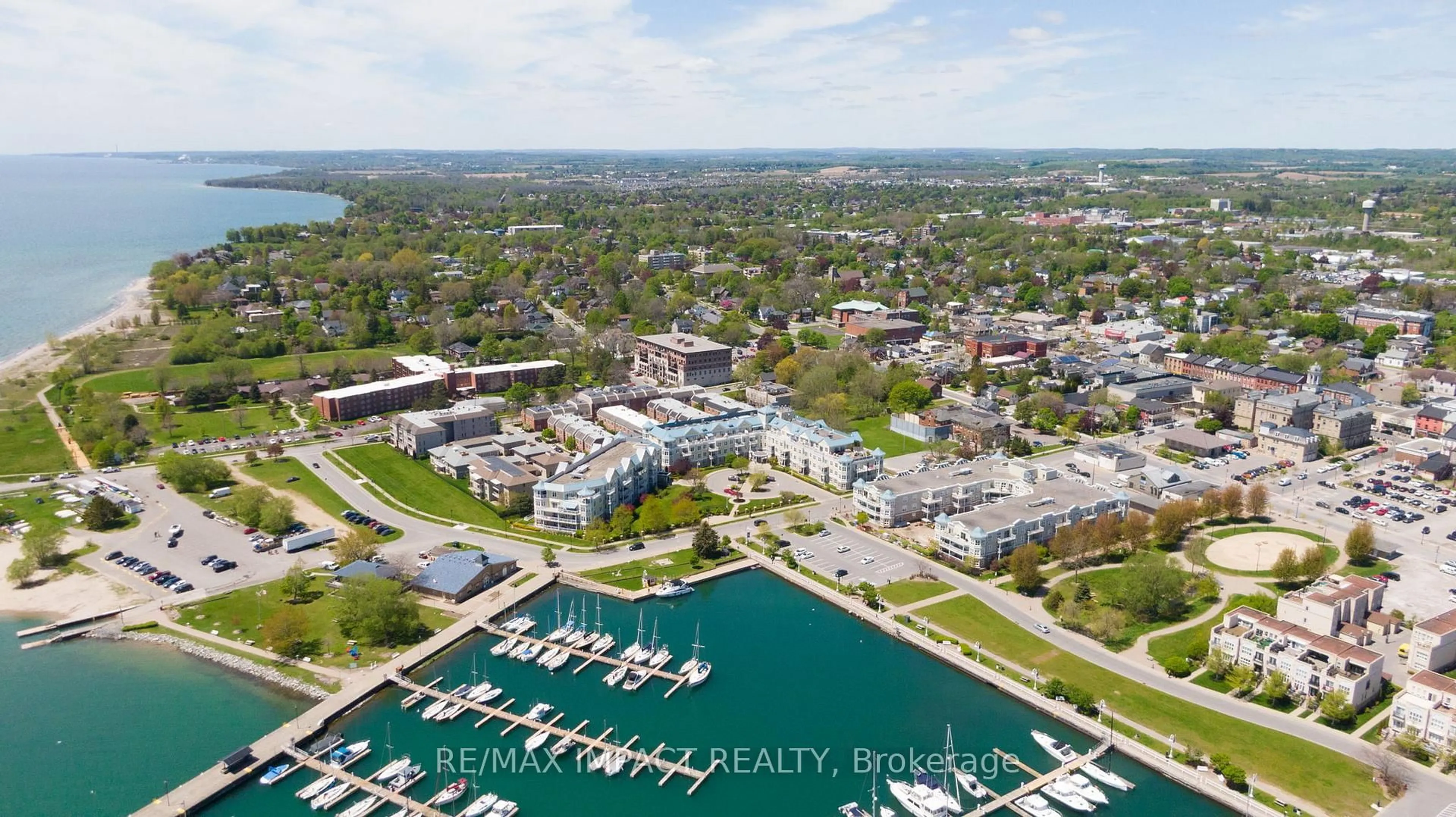 A pic from outside/outdoor area/front of a property/back of a property/a pic from drone, water/lake/river/ocean view for 145 Third St #105, Cobourg Ontario K9A 5X1