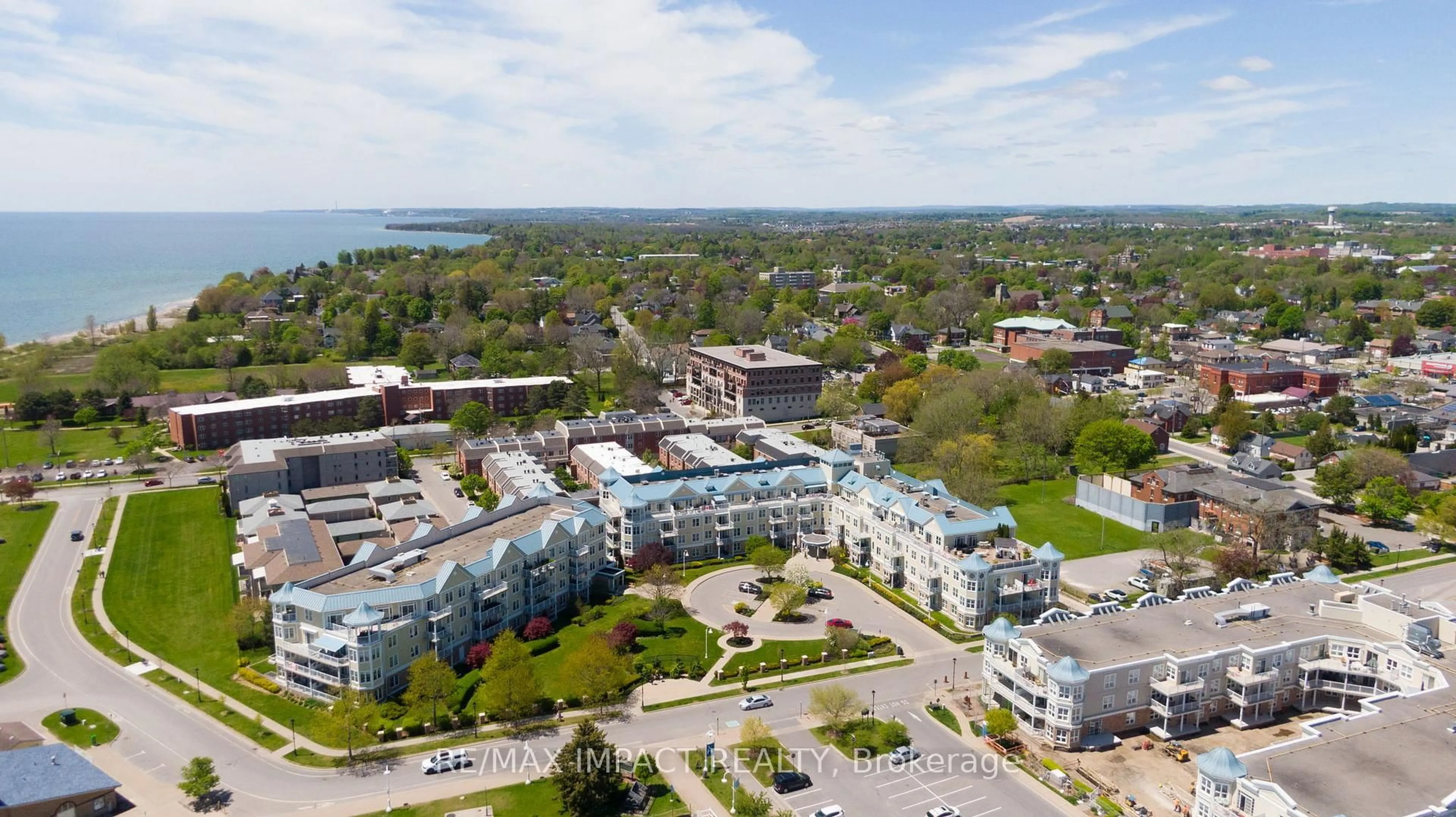 A pic from outside/outdoor area/front of a property/back of a property/a pic from drone, water/lake/river/ocean view for 145 Third St #105, Cobourg Ontario K9A 5X1