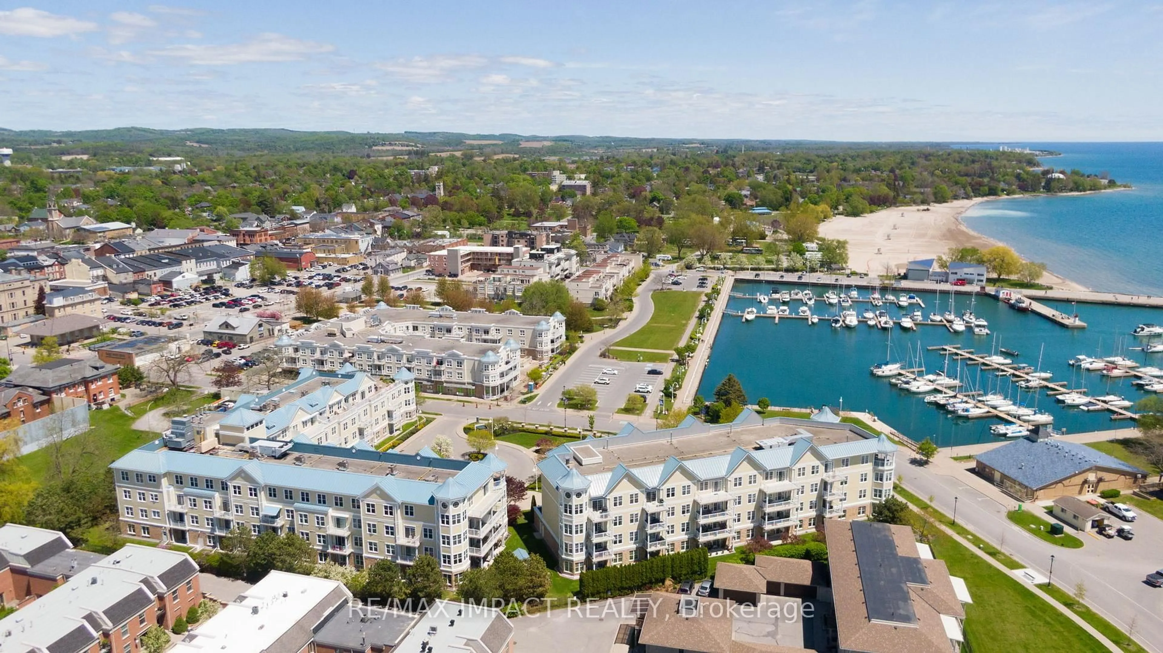 A pic from outside/outdoor area/front of a property/back of a property/a pic from drone, water/lake/river/ocean view for 145 Third St #105, Cobourg Ontario K9A 5X1