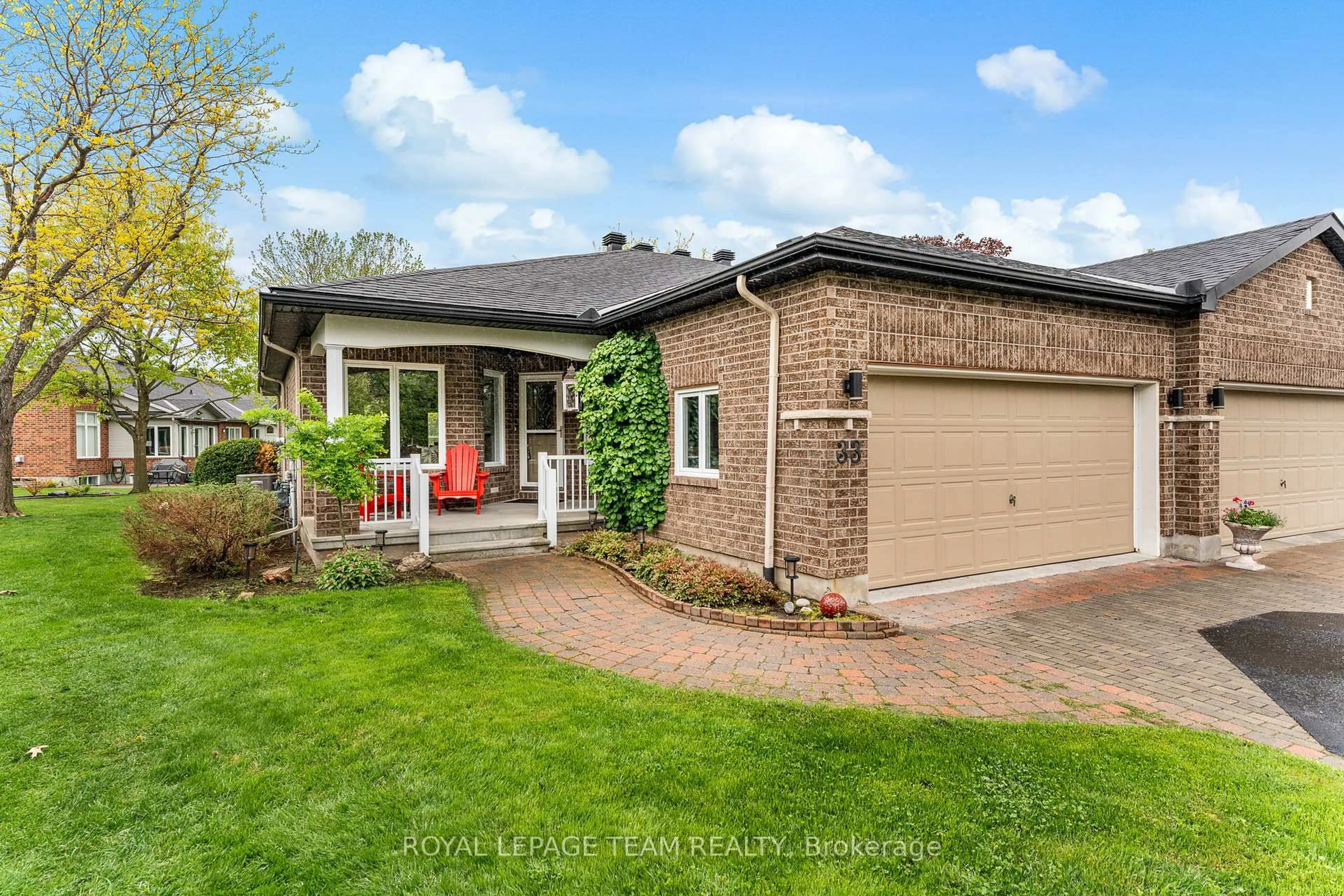 Home with brick exterior material, street for 33 Waterthrush Cres, Ottawa Ontario K2M 2T8