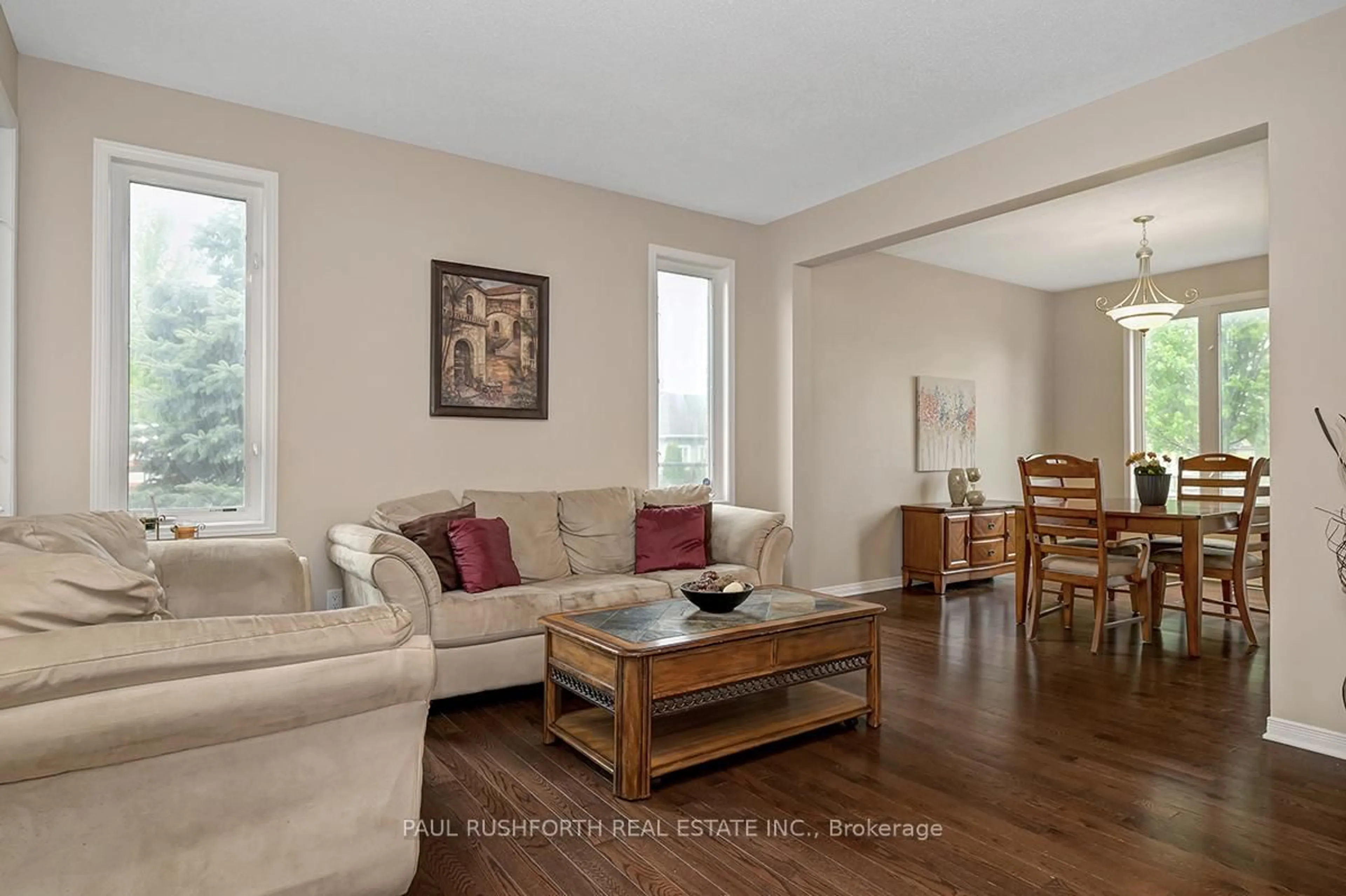 Living room with furniture, wood/laminate floor for 200 Allgrove Way, Ottawa Ontario K2S 2H7