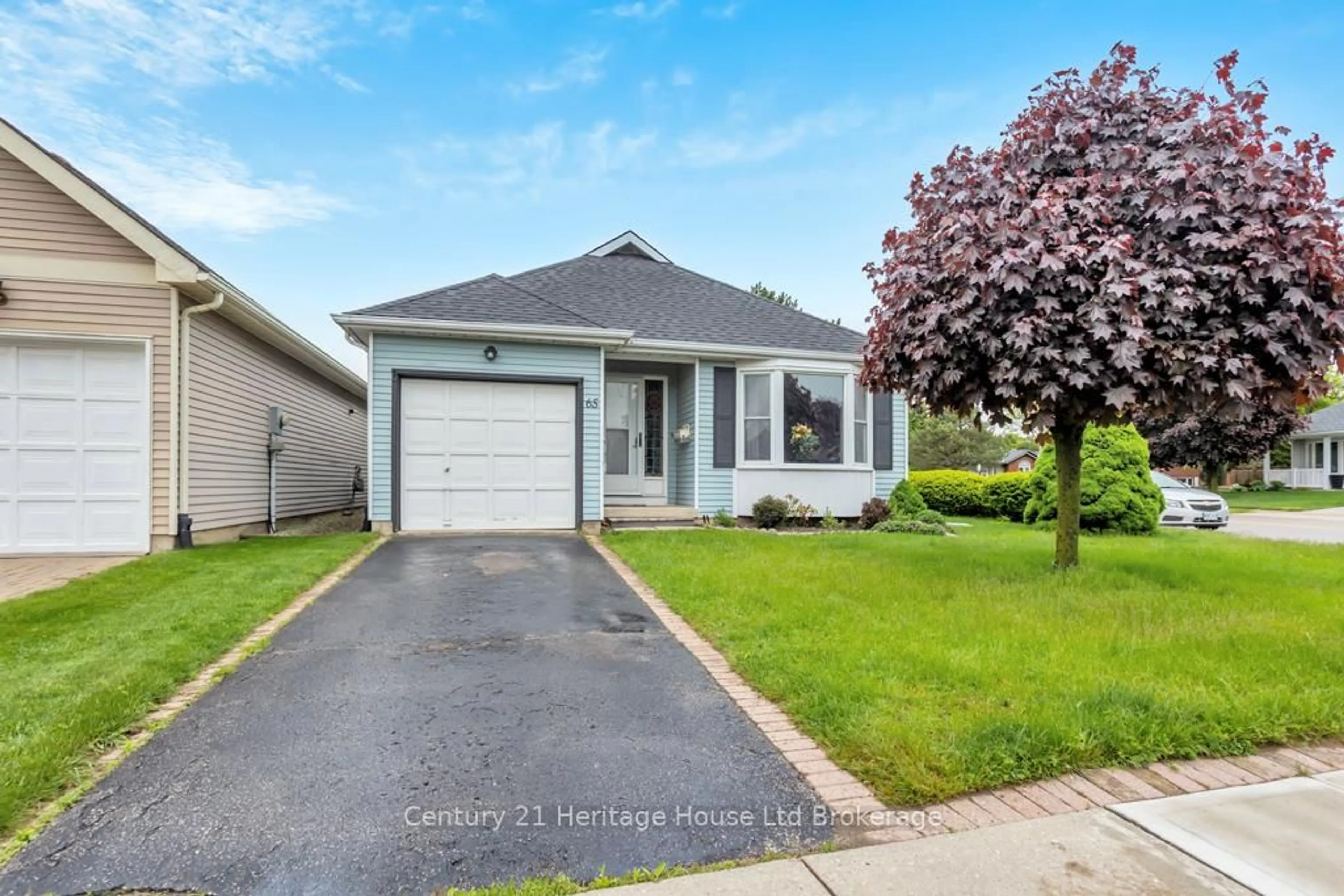 Home with vinyl exterior material, street for 65 Seres Dr, Tillsonburg Ontario N4G 5E7