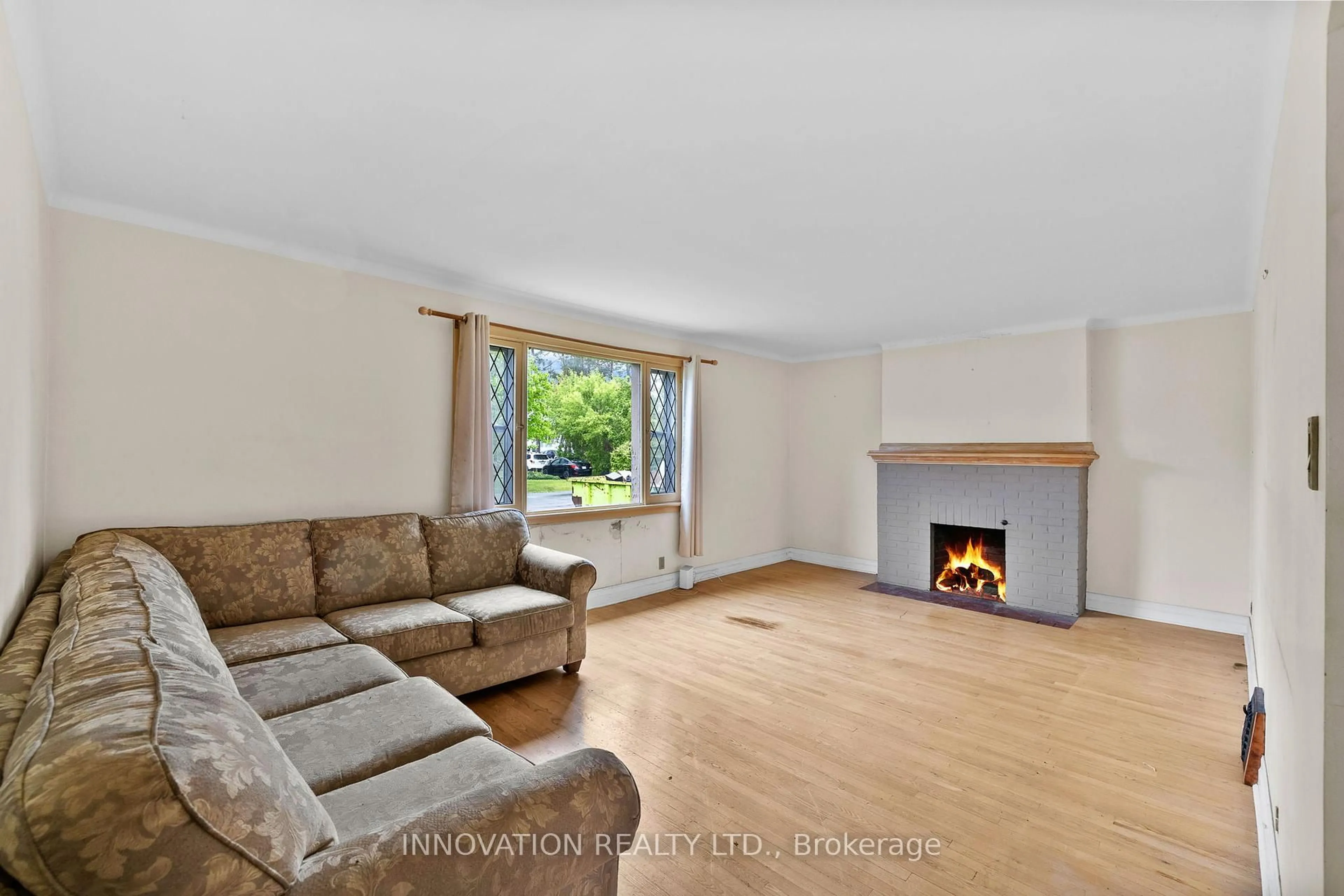 Living room with furniture, wood/laminate floor for 475 Woodland Ave, Ottawa Ontario K2B 5E3