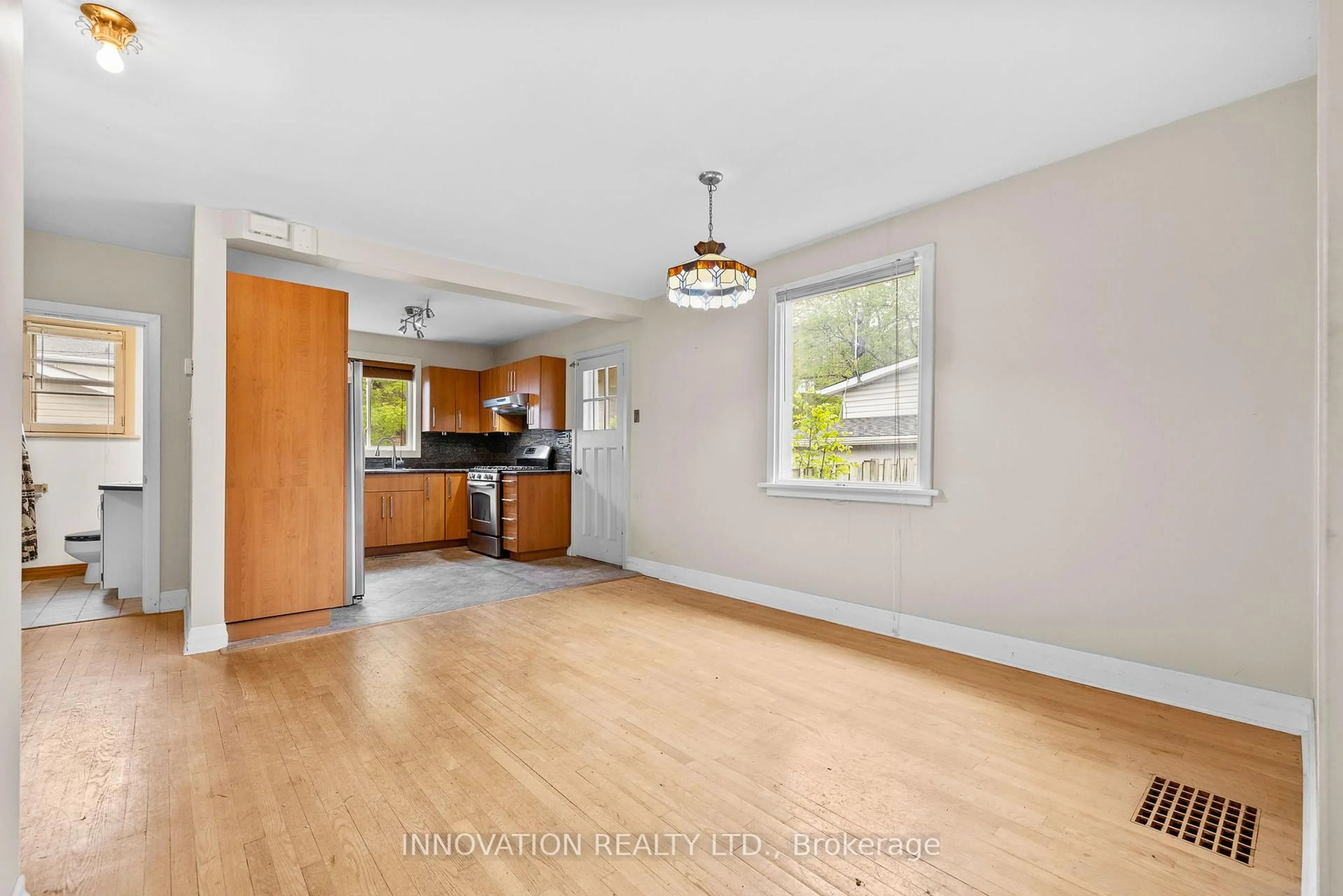 Open concept kitchen, wood/laminate floor for 475 Woodland Ave, Ottawa Ontario K2B 5E3
