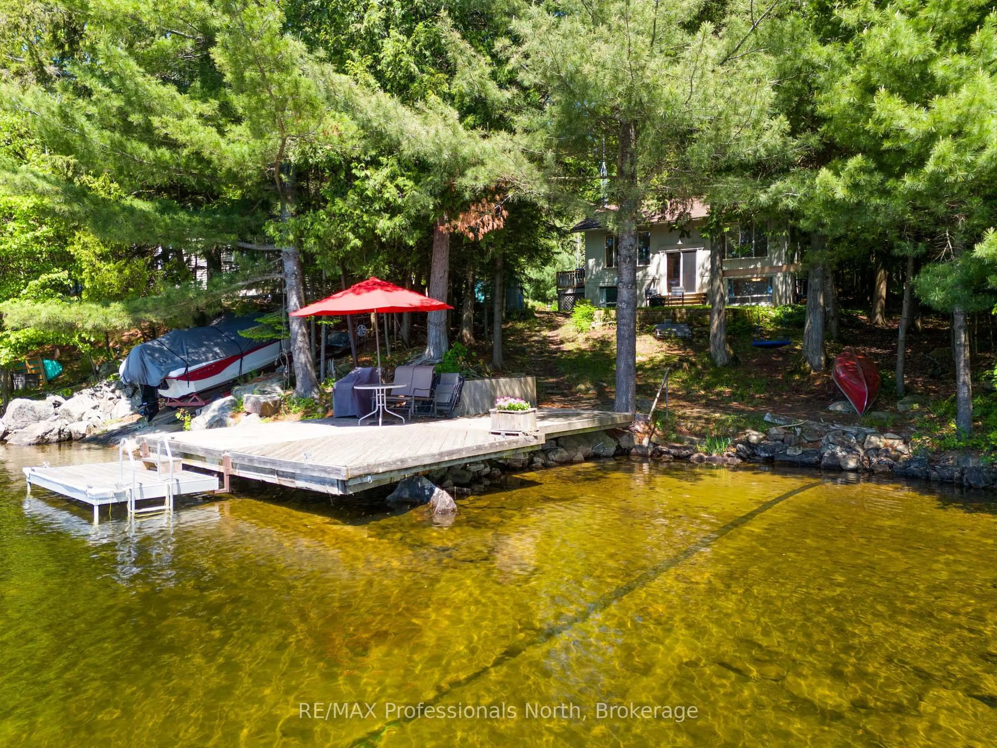 A pic from outside/outdoor area/front of a property/back of a property/a pic from drone, water/lake/river/ocean view for 1014 REID Lane, Lake of Bays Ontario P0A 1H0