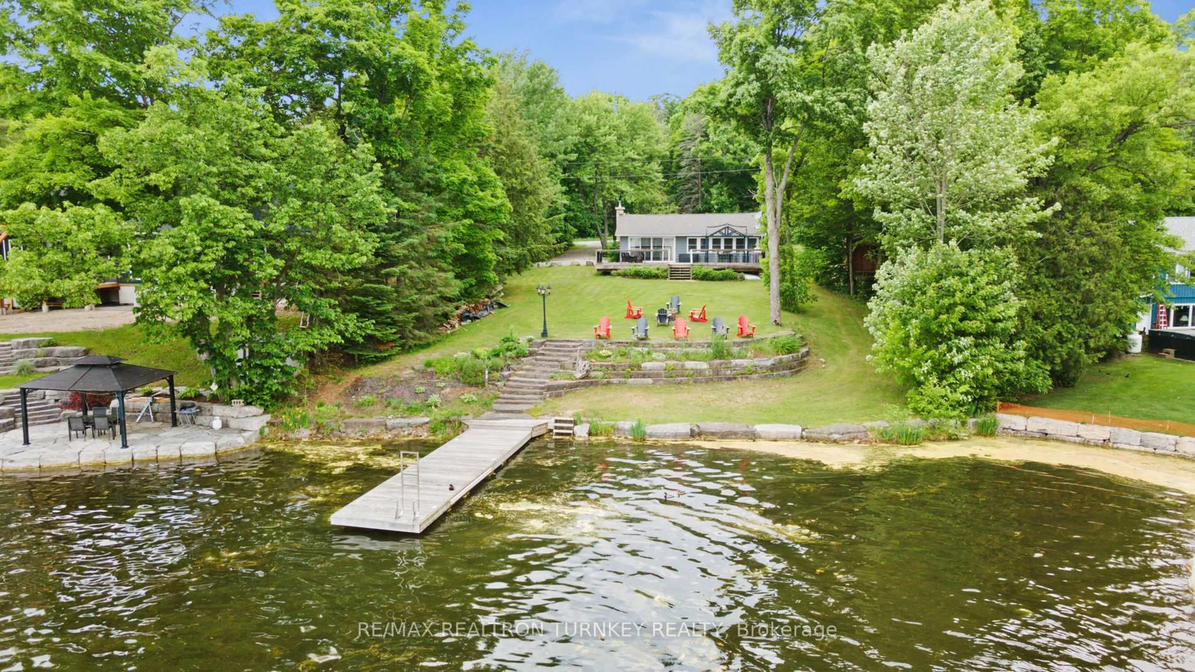 A pic from outside/outdoor area/front of a property/back of a property/a pic from drone, water/lake/river/ocean view for 310 Northern Ave, Trent Lakes Ontario K0M 1A0