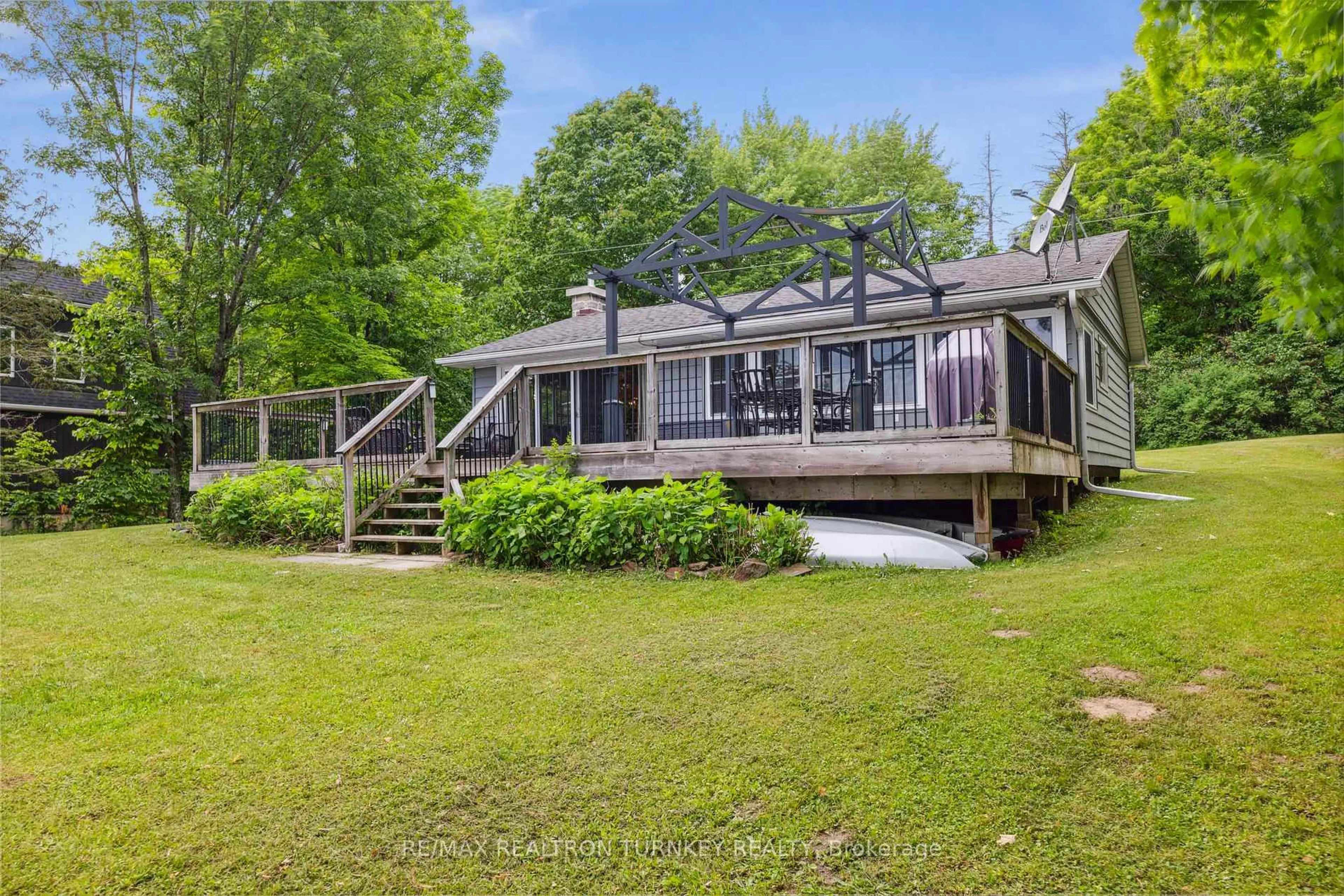 A pic from outside/outdoor area/front of a property/back of a property/a pic from drone, water/lake/river/ocean view for 310 Northern Ave, Trent Lakes Ontario K0M 1A0