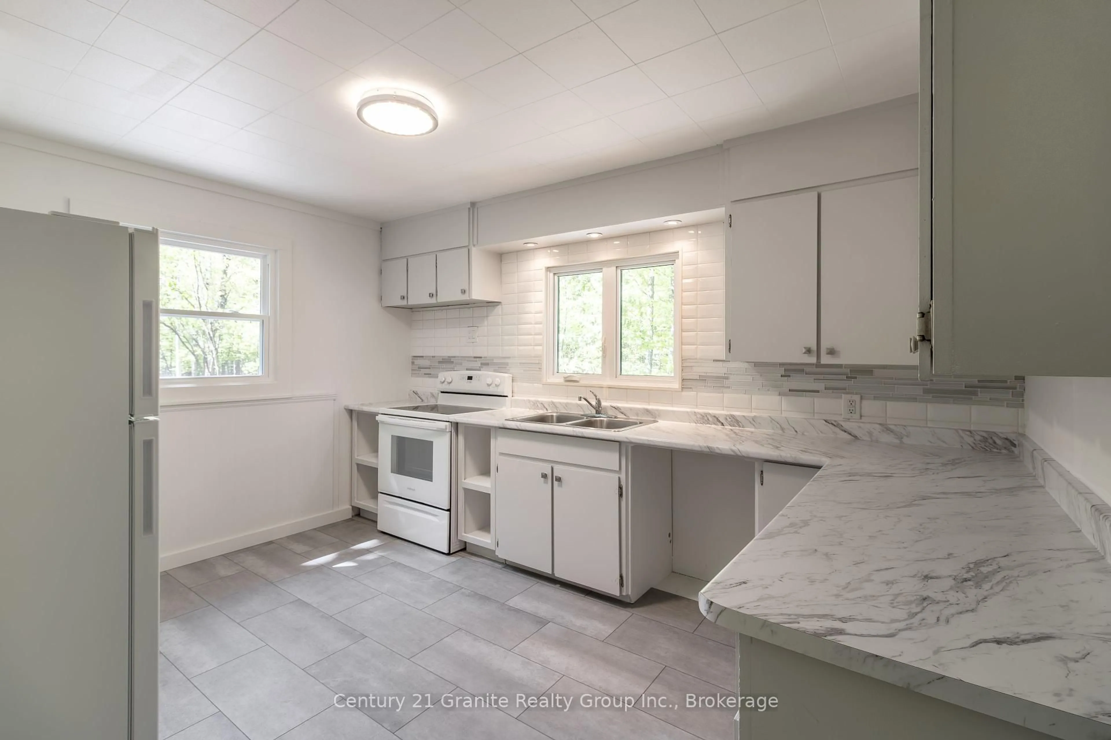 Open concept kitchen, ceramic/tile floor for 426 Mountain St, Dysart et al Ontario K0M 1S0