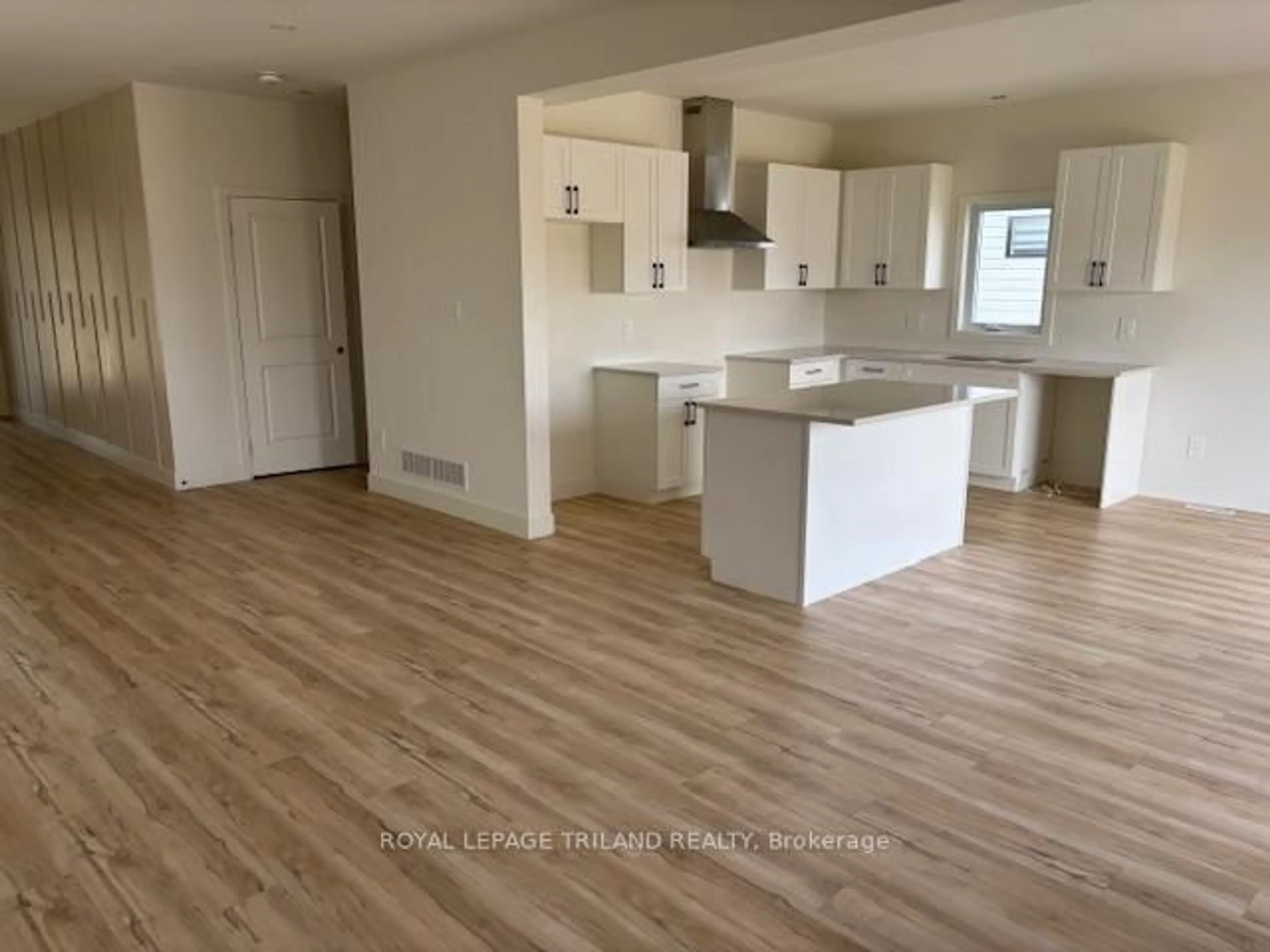 Open concept kitchen, wood/laminate floor for 1524 Twilite Blvd, London North Ontario N6G 3P2