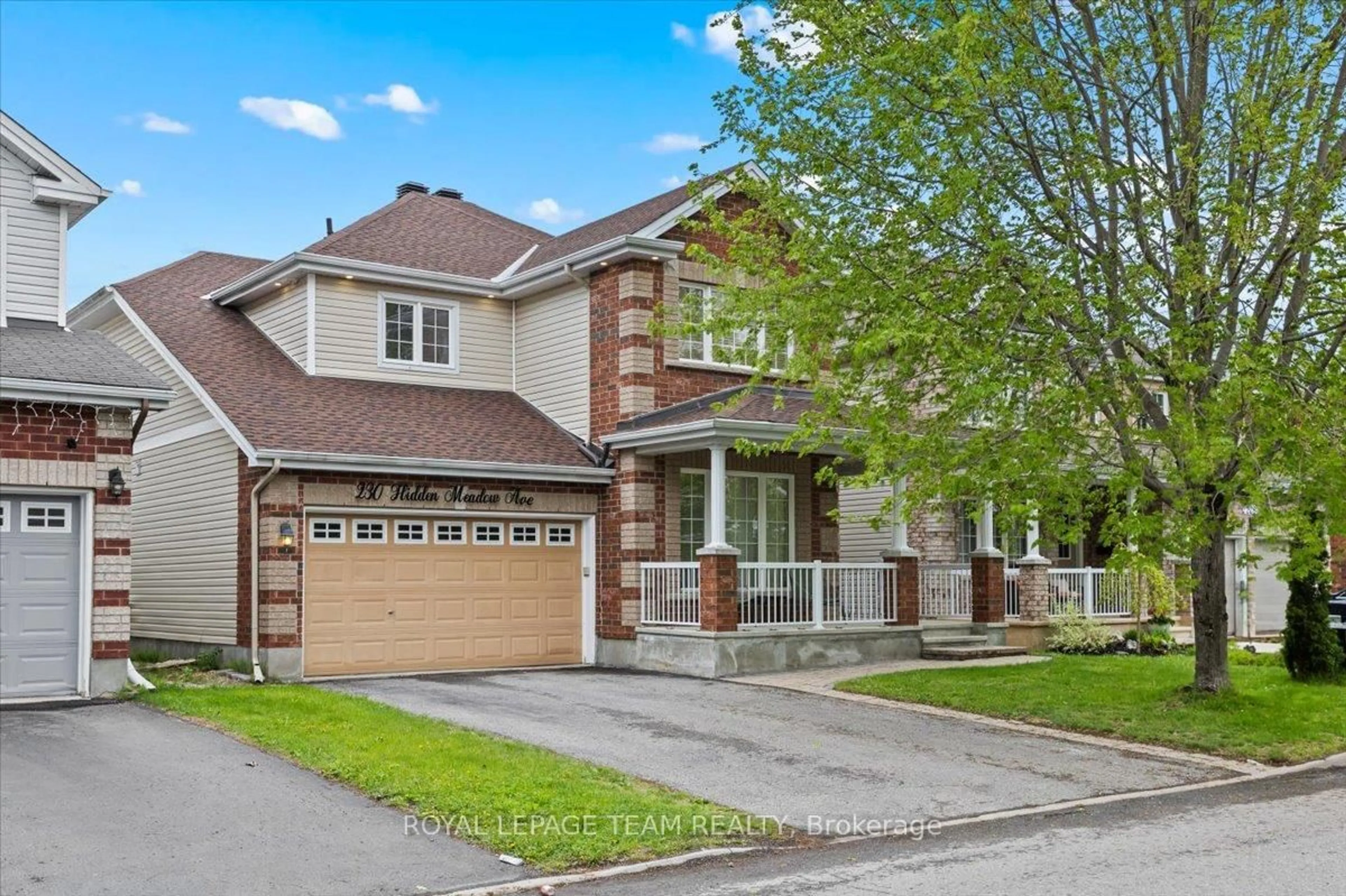 Home with brick exterior material, street for 230 Hidden Meadow Ave, Ottawa Ontario K1T 0C1