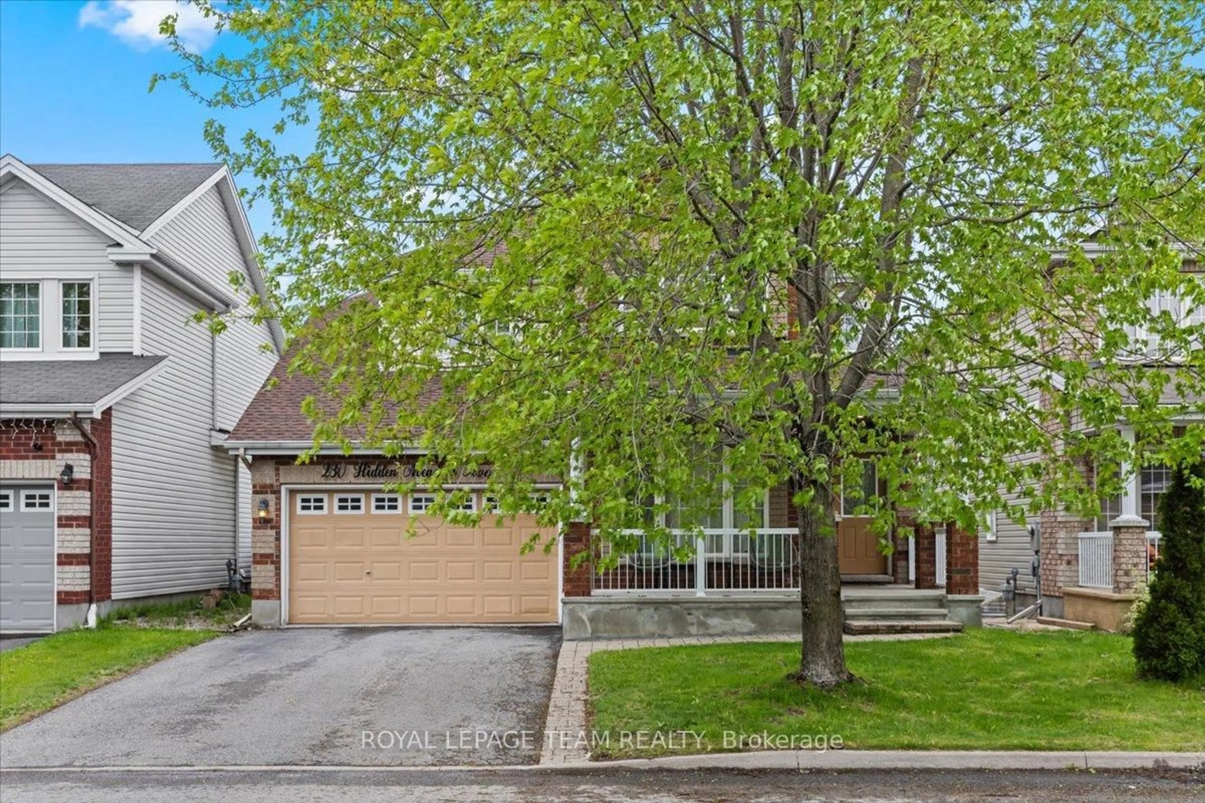 Home with brick exterior material, street for 230 Hidden Meadow Ave, Ottawa Ontario K1T 0C1