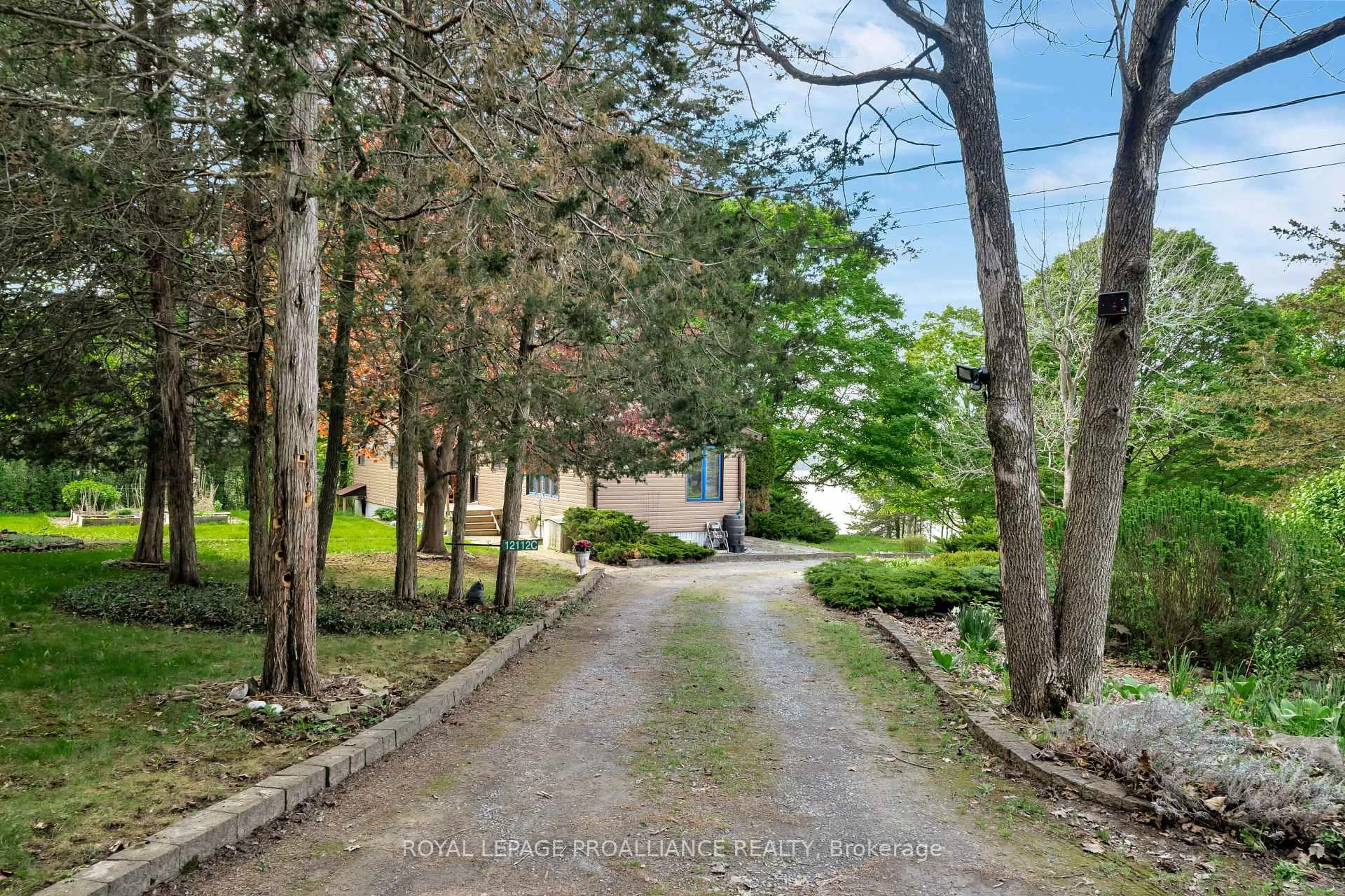 A pic from outside/outdoor area/front of a property/back of a property/a pic from drone, street for 12112C Loyalist Pkwy, Prince Edward County Ontario K0K 2T0