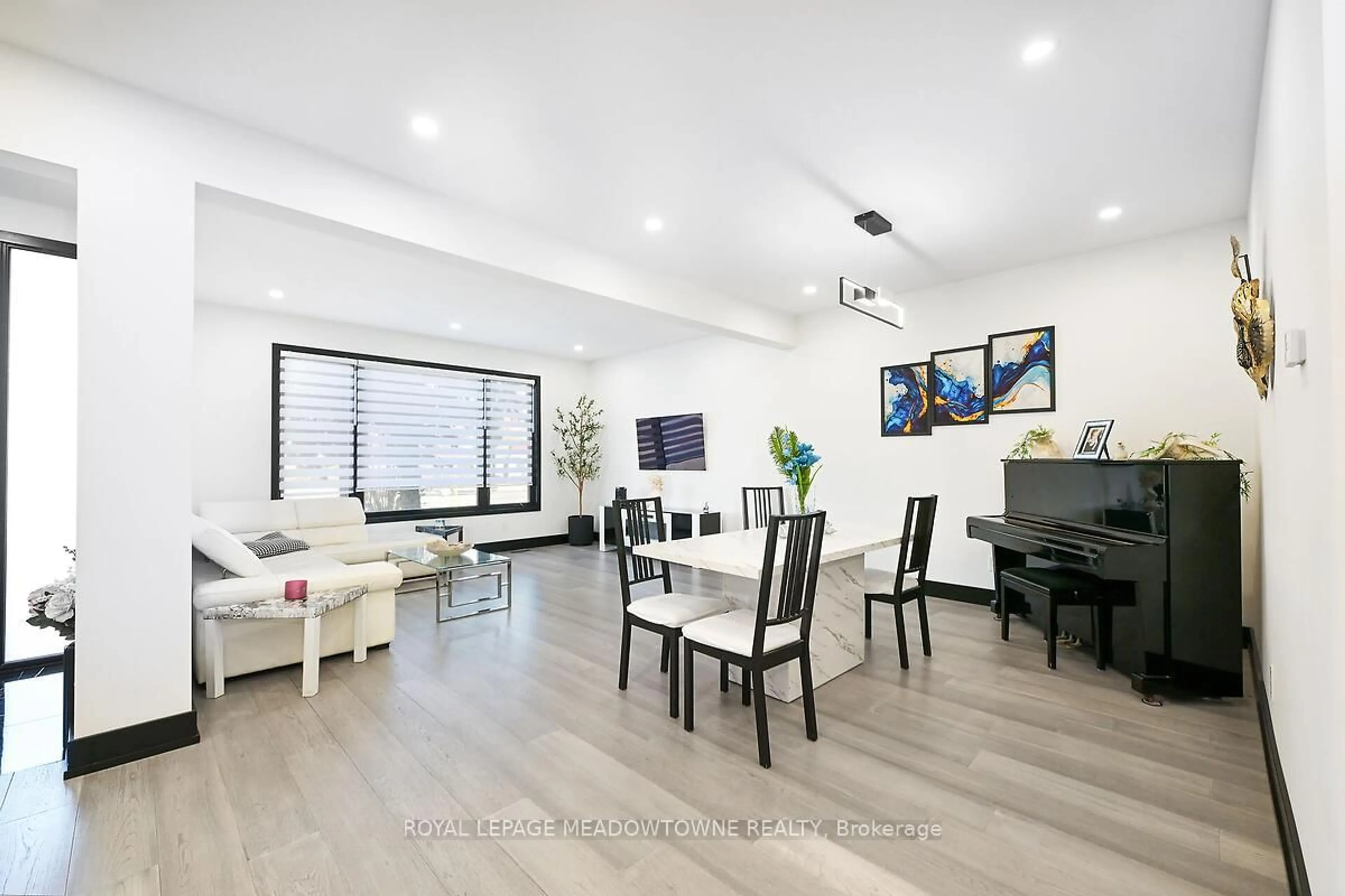 Living room with furniture, wood/laminate floor for 374 Highway 8, Hamilton Ontario L8G 1E8