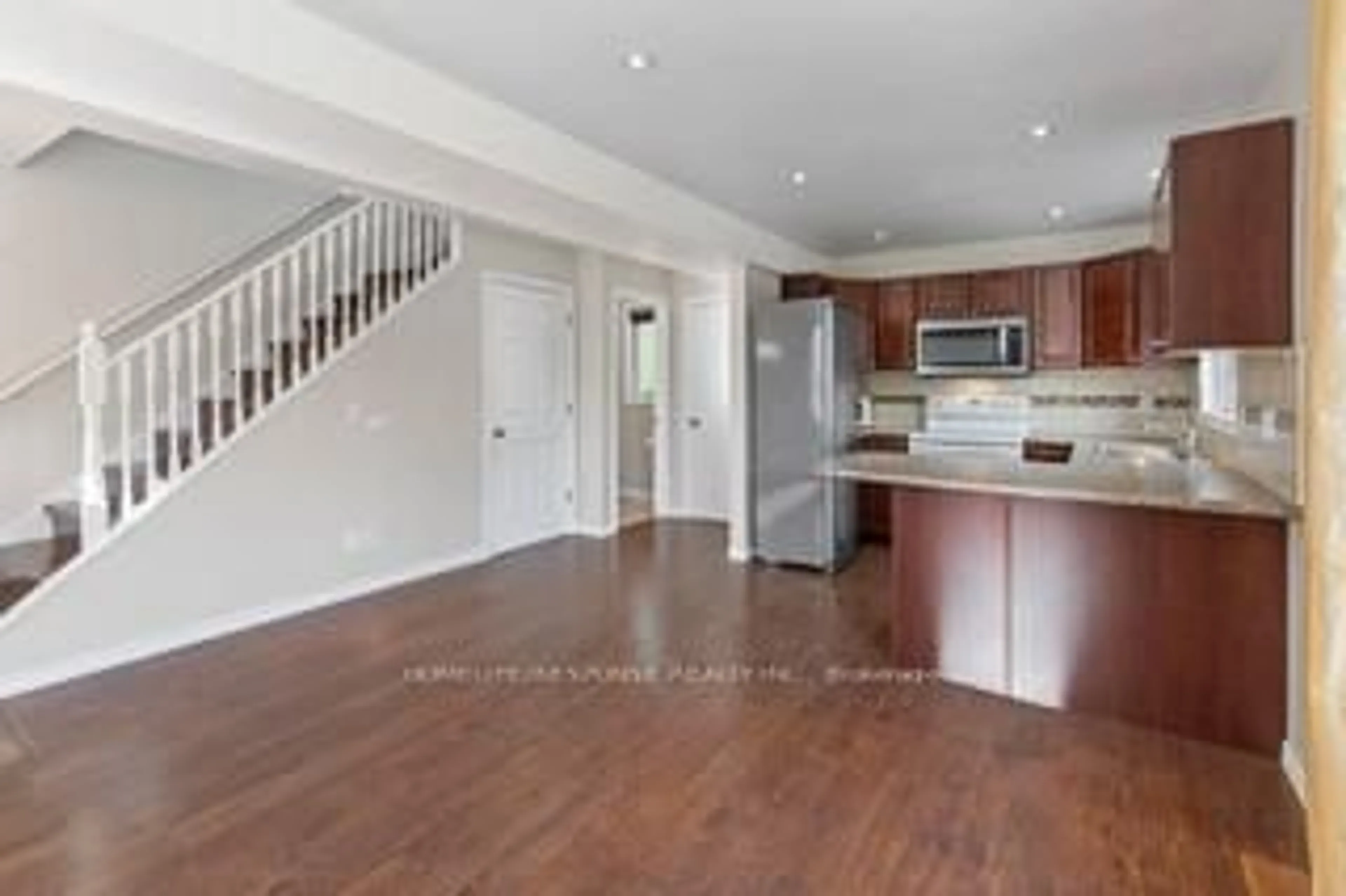 Open concept kitchen, wood/laminate floor for 5135 MORRISON St, Niagara Falls Ontario L2E 2E2