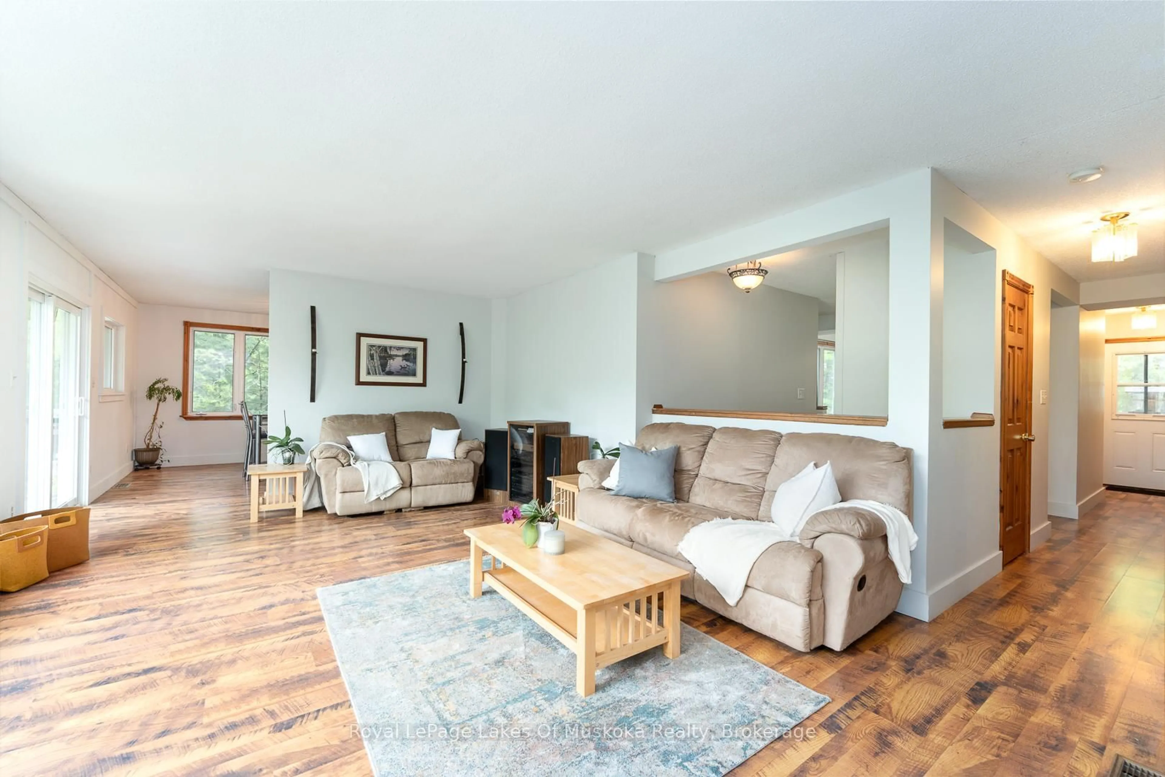 Living room with furniture, wood/laminate floor for 1075 Rocky Narrows Rd, Bracebridge Ontario P1L 1X1