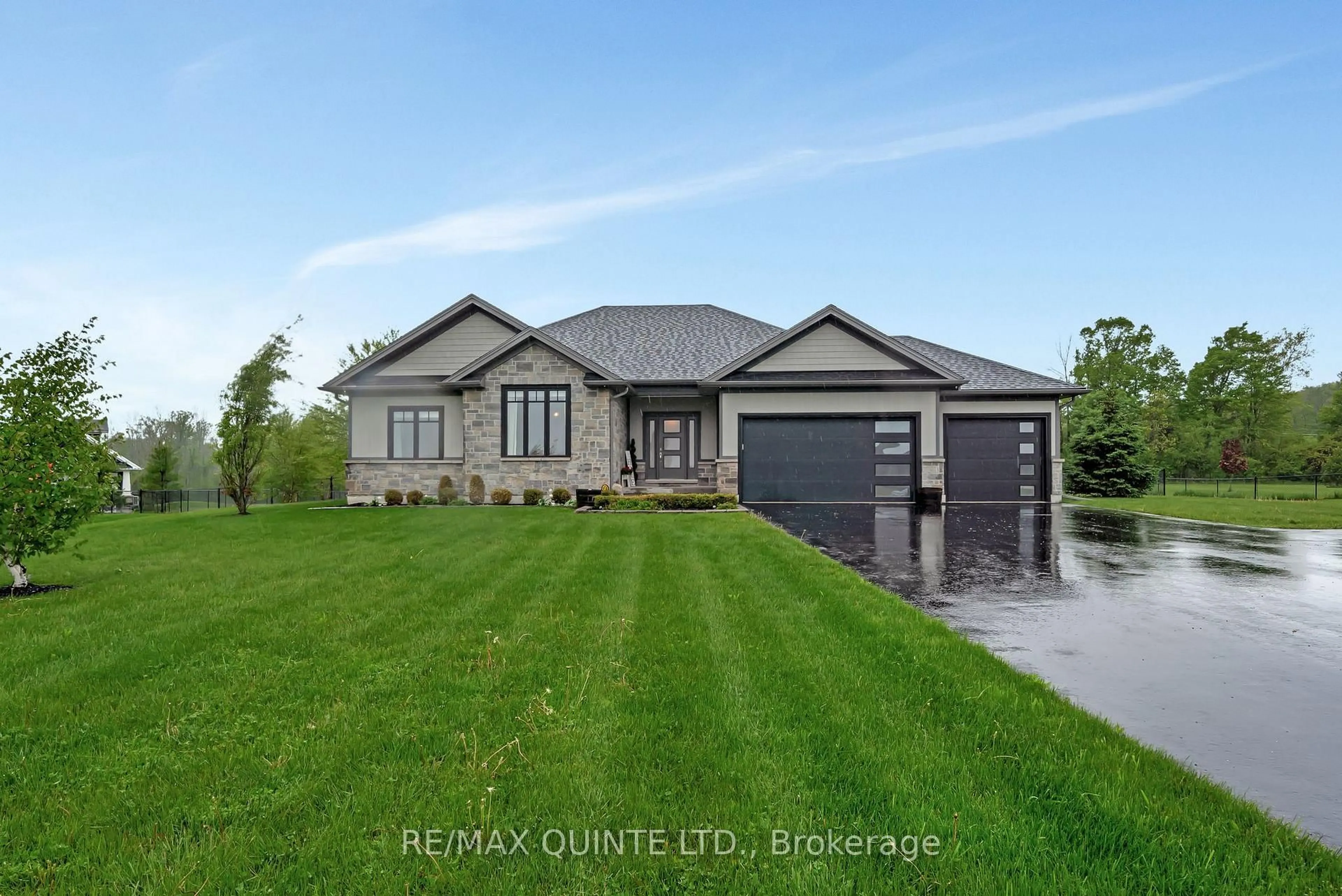 Home with brick exterior material, street for 39 Woodland Tr, Prince Edward County Ontario K8N 4Z1