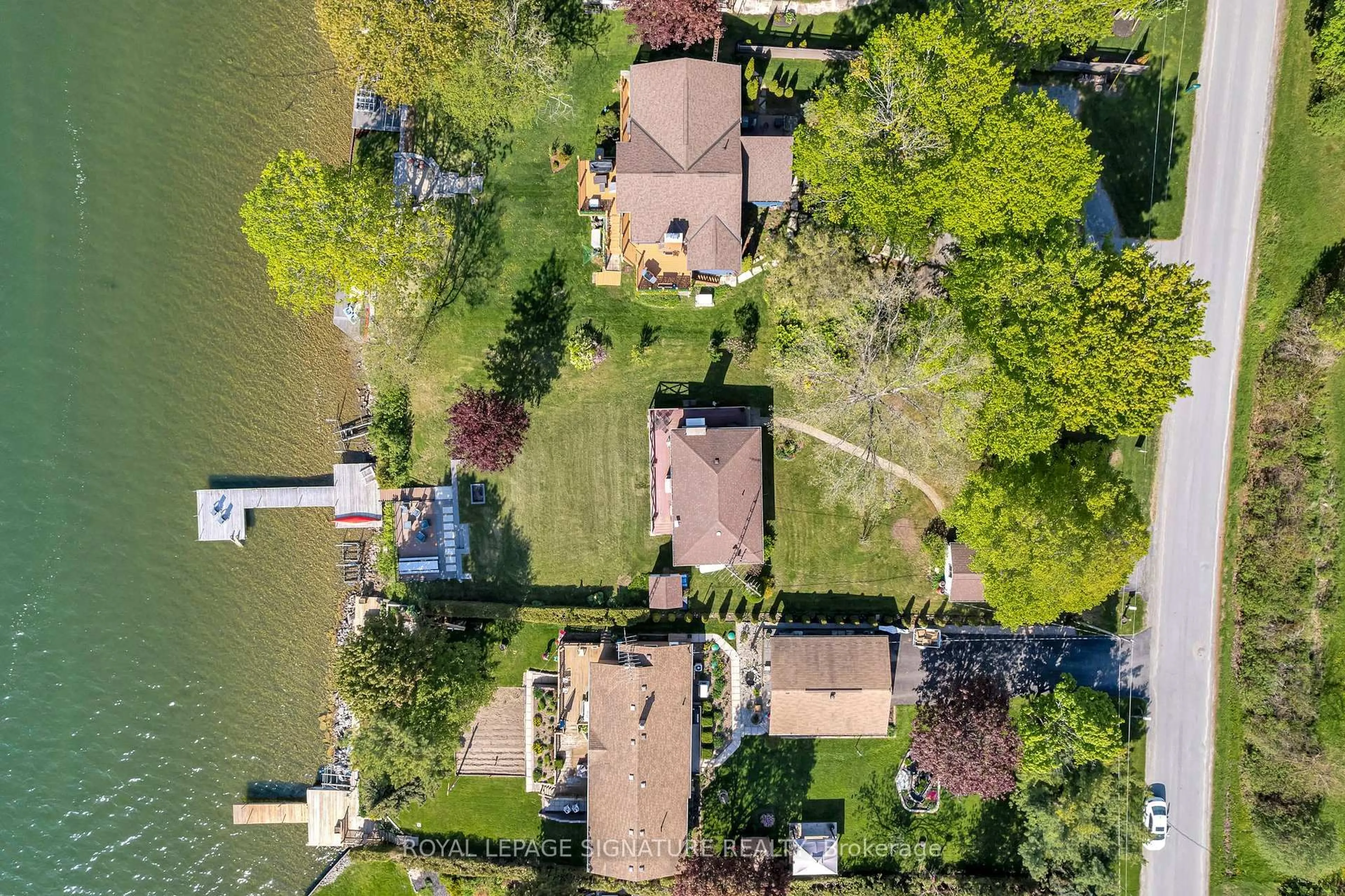 A pic from outside/outdoor area/front of a property/back of a property/a pic from drone, water/lake/river/ocean view for 318 Island Rd, Prince Edward County Ontario K0K 2T0