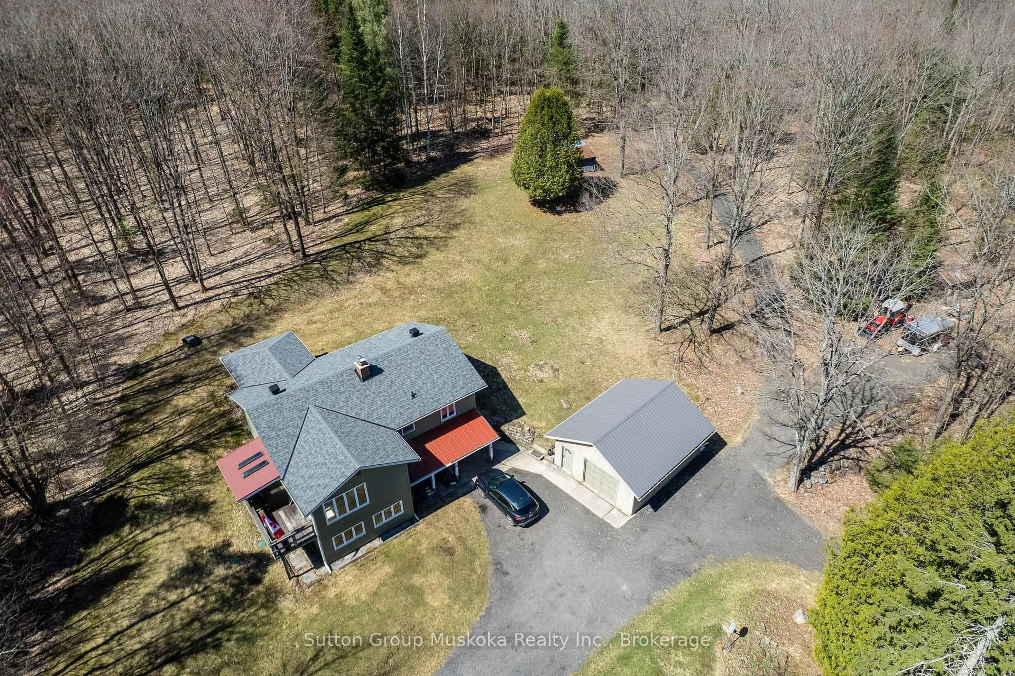 A pic from outside/outdoor area/front of a property/back of a property/a pic from drone, unknown for 124 Old School House Rd, Huntsville Ontario P1H 2J4