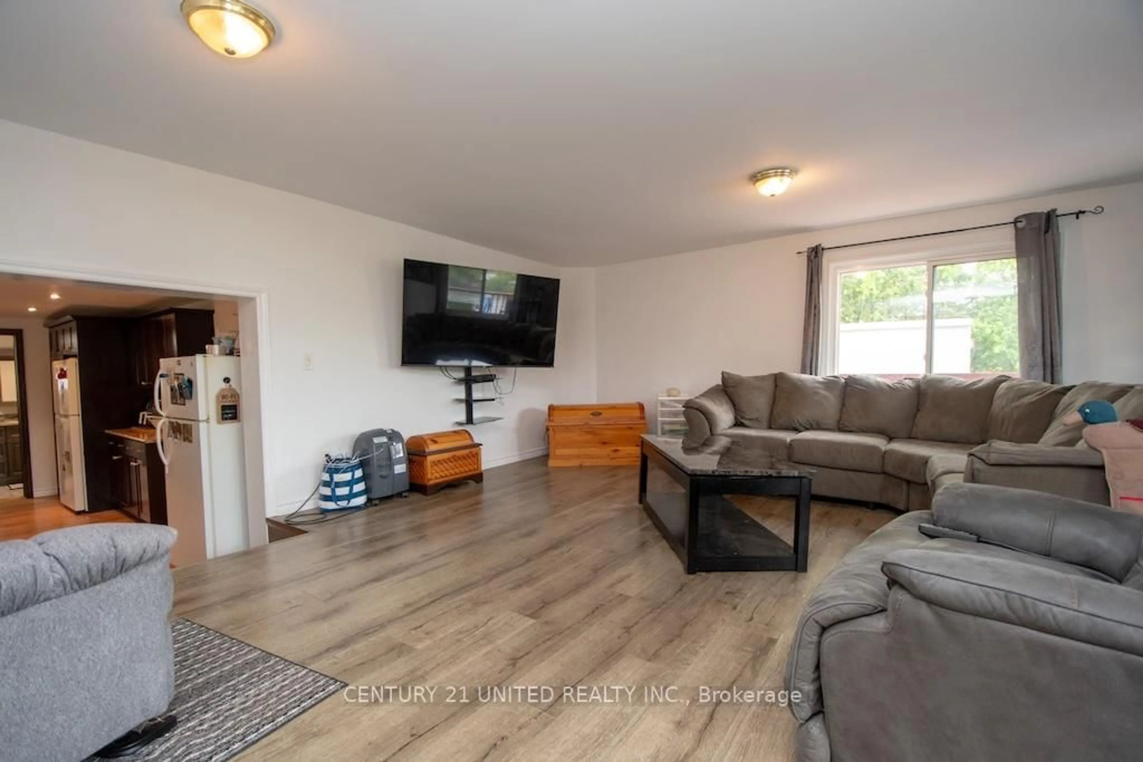 Living room with furniture, wood/laminate floor for 71 Cedar Dr, Trent Hills Ontario K0L 1Y0
