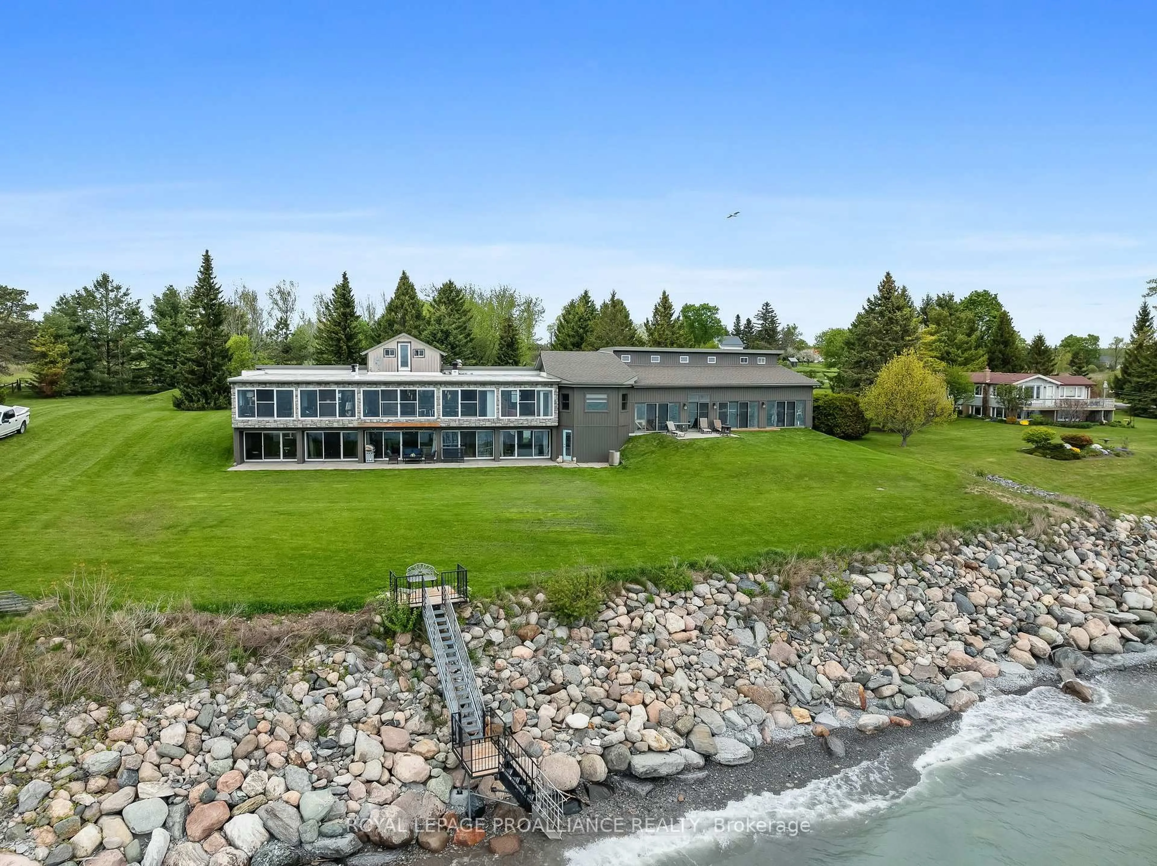 A pic from outside/outdoor area/front of a property/back of a property/a pic from drone, water/lake/river/ocean view for 431 Victoria Beach Rd, Cramahe Ontario K0K 1S0