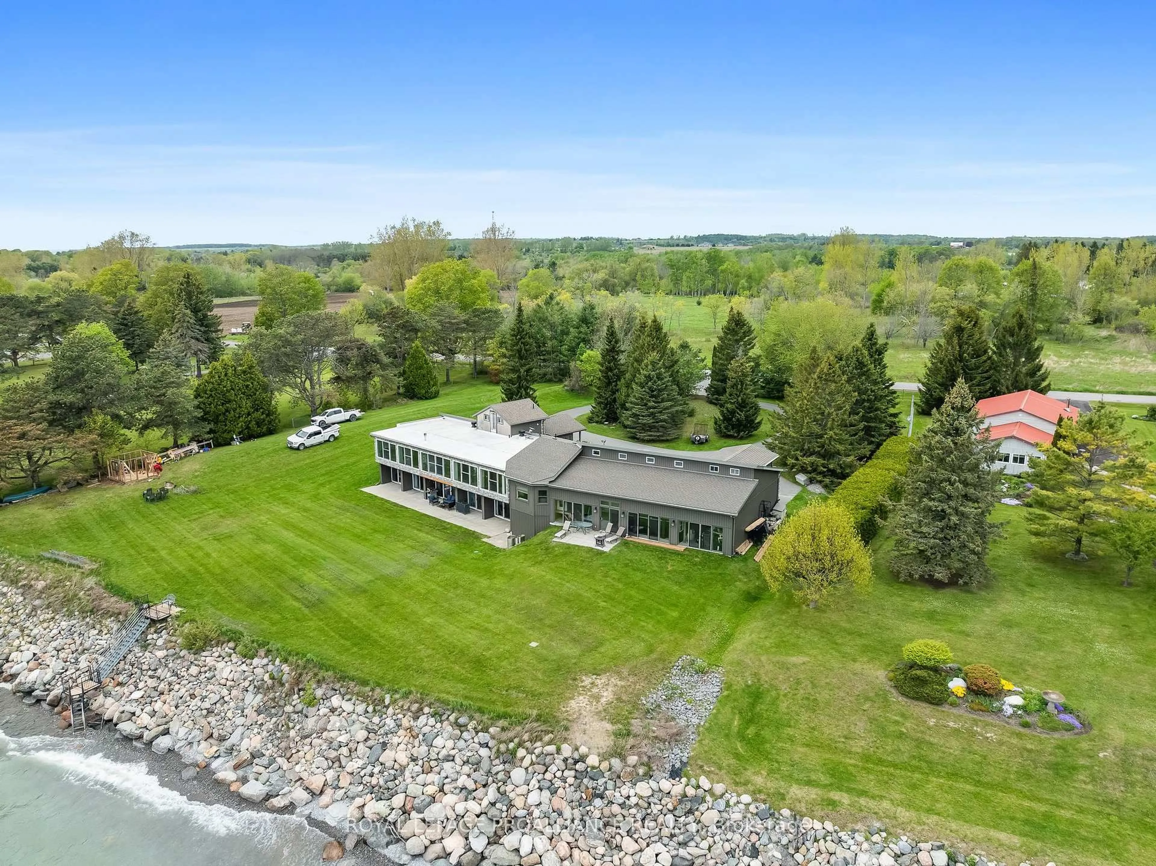 A pic from outside/outdoor area/front of a property/back of a property/a pic from drone, water/lake/river/ocean view for 431 Victoria Beach Rd, Cramahe Ontario K0K 1S0