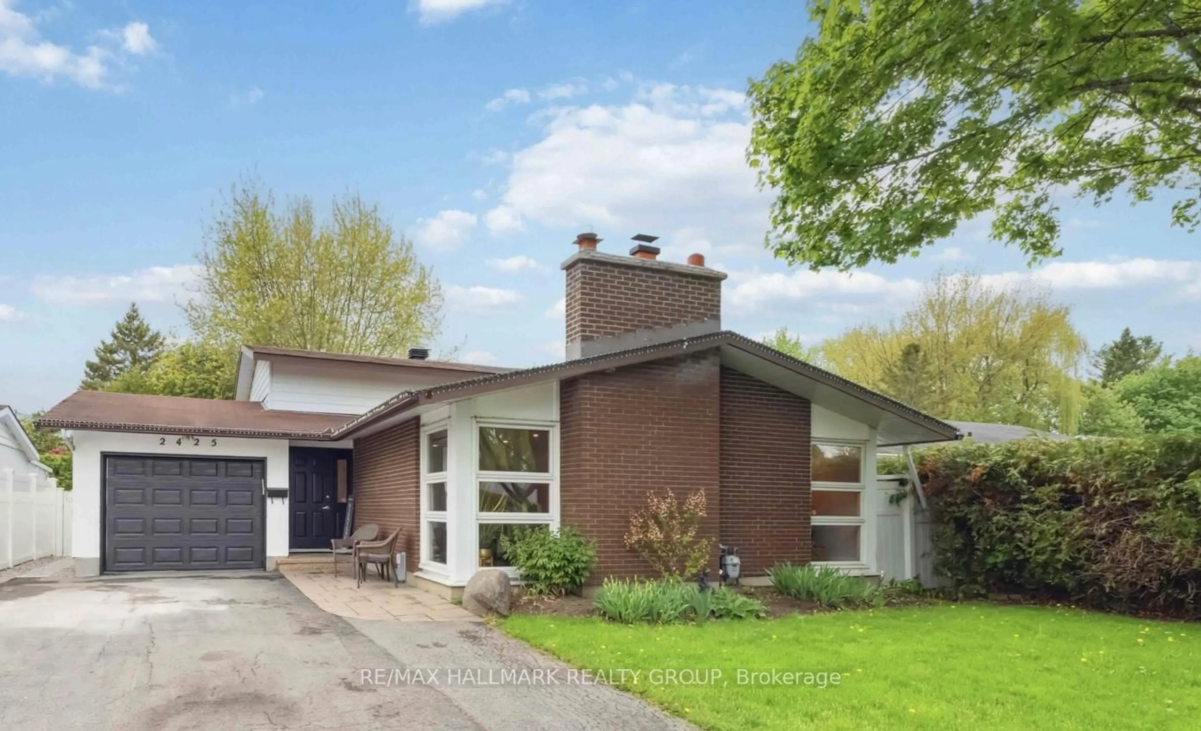 Home with brick exterior material, street for 2425 Ogilvie Rd, Ottawa Ontario K1J 7N3