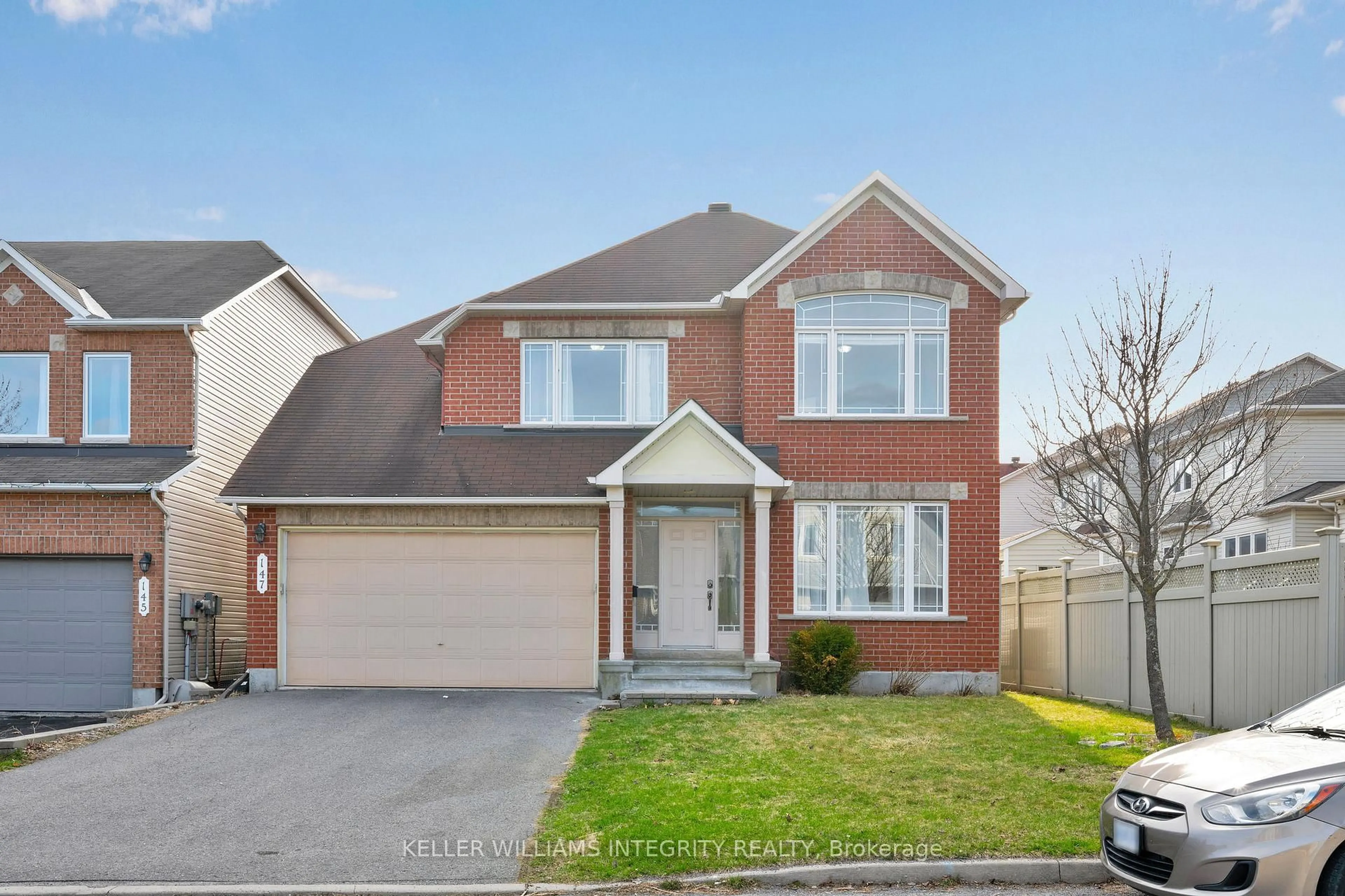 Home with brick exterior material, street for 147 Millgreen Cres, Ottawa Ontario K1J 1K4