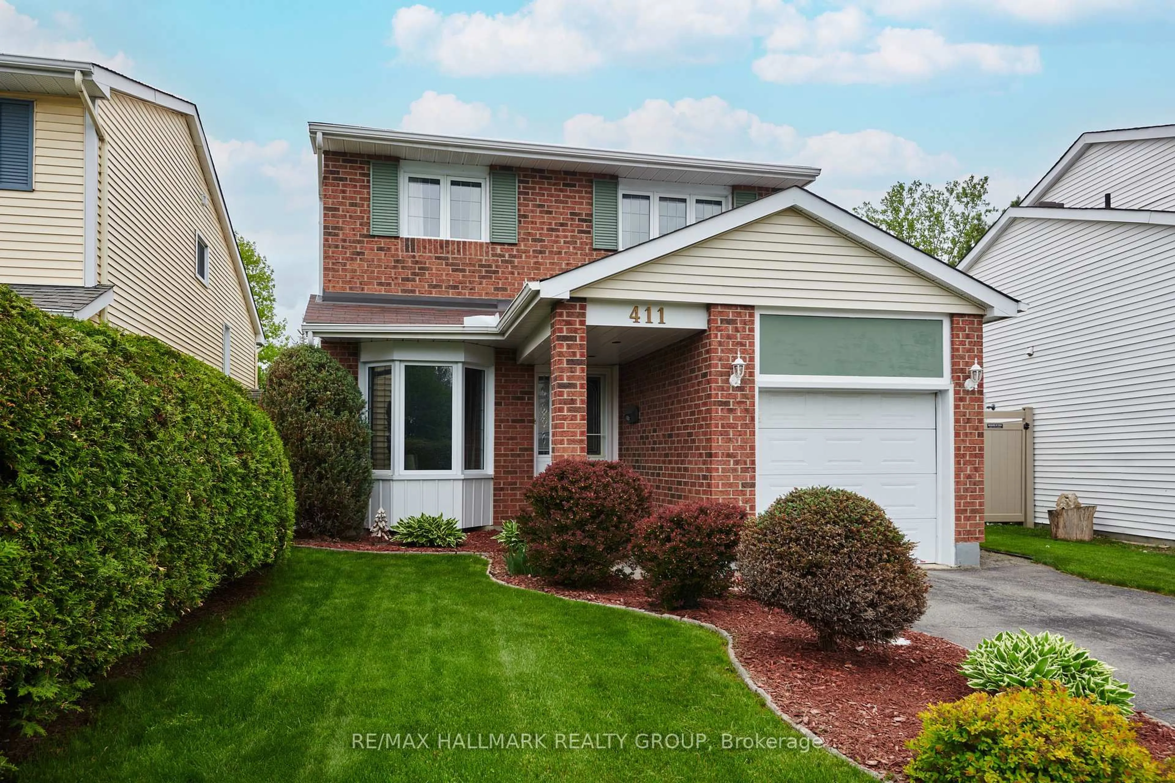 Home with brick exterior material, street for 411 Sanderling Cres, Orleans Ontario K1E 2V5