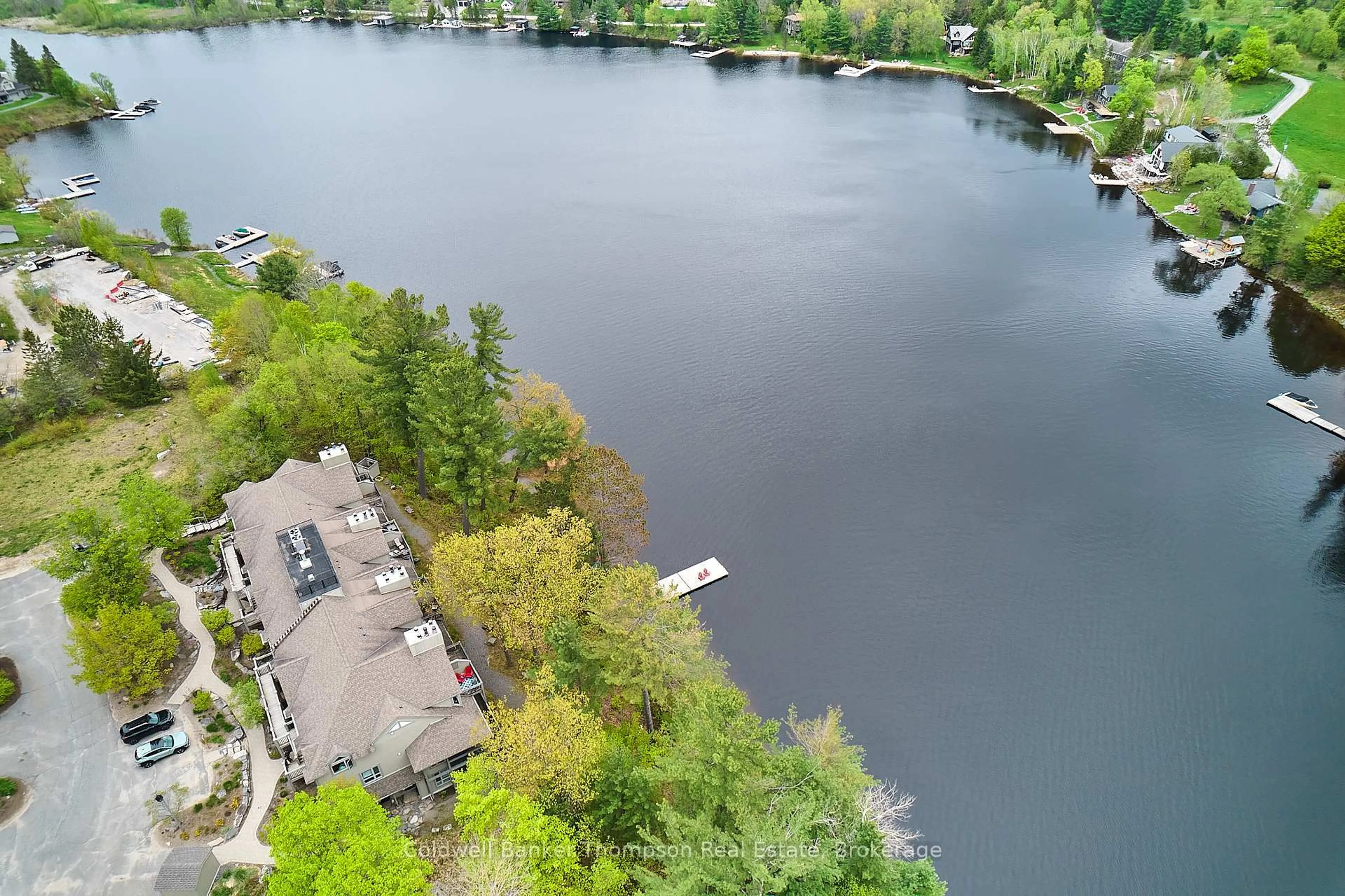 A pic from outside/outdoor area/front of a property/back of a property/a pic from drone, water/lake/river/ocean view for 5811 Grandview Signature Dr, Huntsville Ontario P1H 2N1