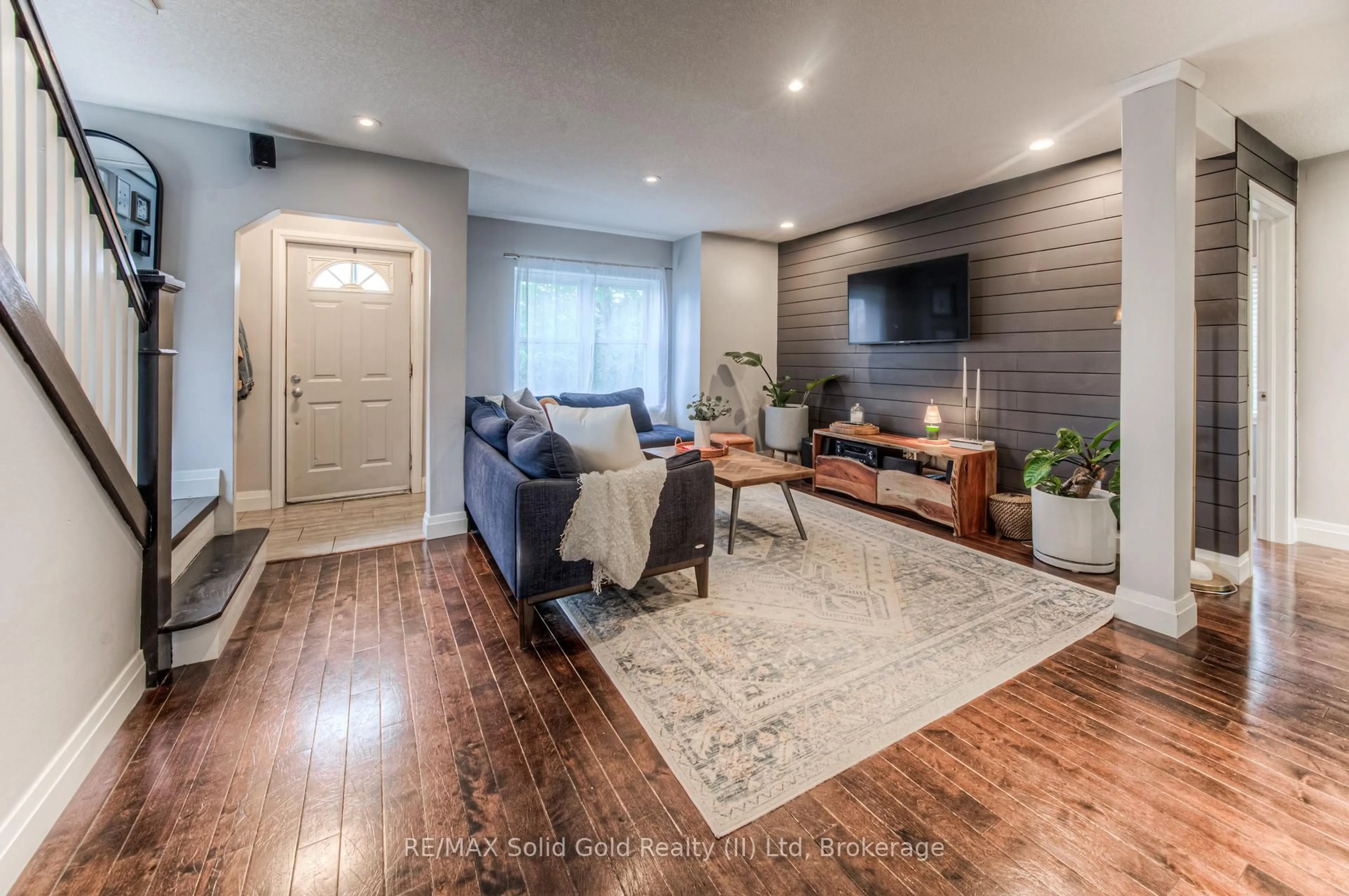 Living room with furniture, wood/laminate floor for 742 Elizabeth St, Kitchener Ontario N2H 6H3