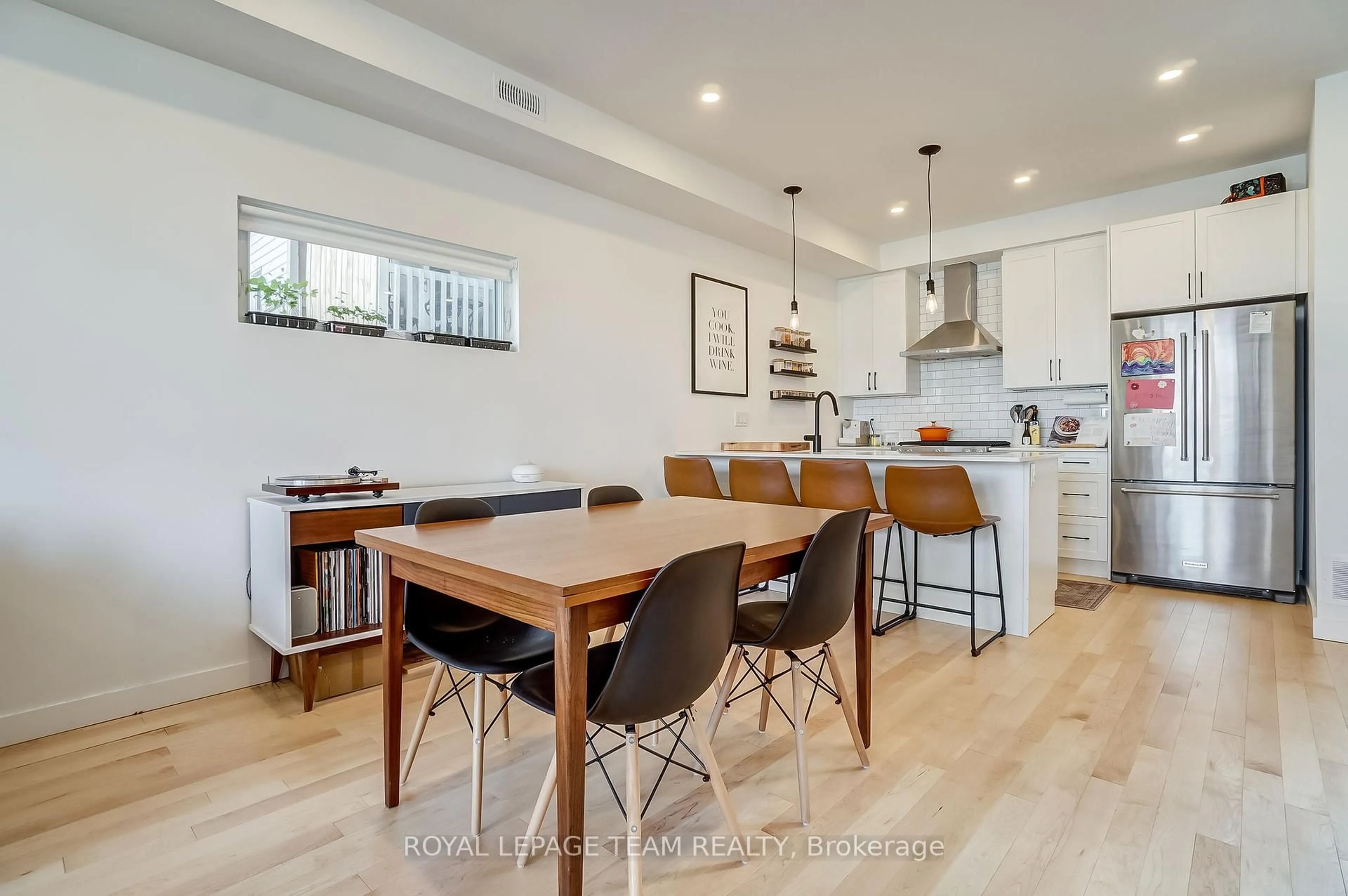 Open concept kitchen, wood/laminate floor for 123-125 Carruthers Ave, Ottawa Ontario K1Y 1N4