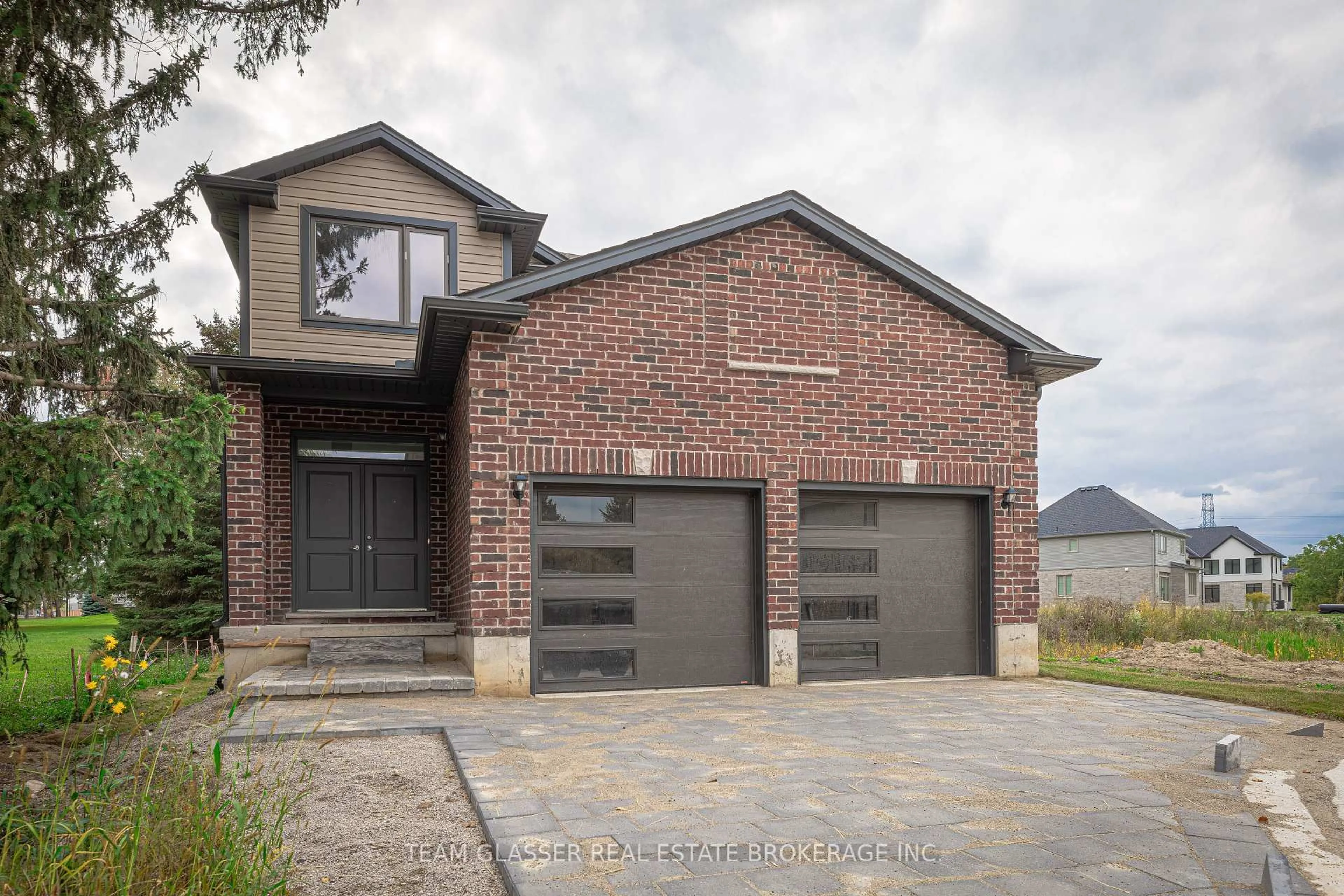 Home with brick exterior material, street for 1604 Chickadee Tr, London South Ontario N6N 1K2