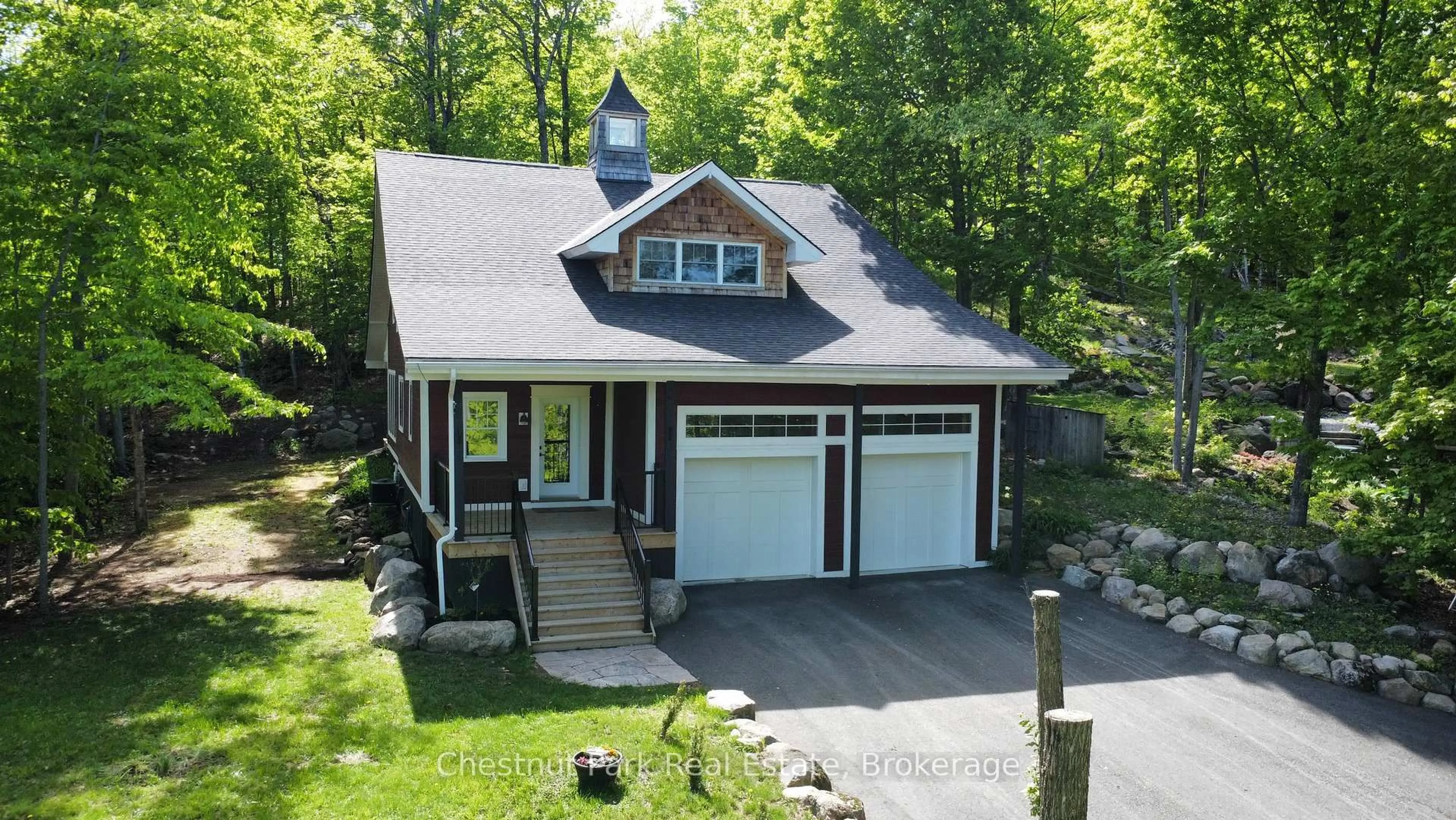 A pic from outside/outdoor area/front of a property/back of a property/a pic from drone, street for 39 Todholm Dr, Muskoka Lakes Ontario P0B 1J0