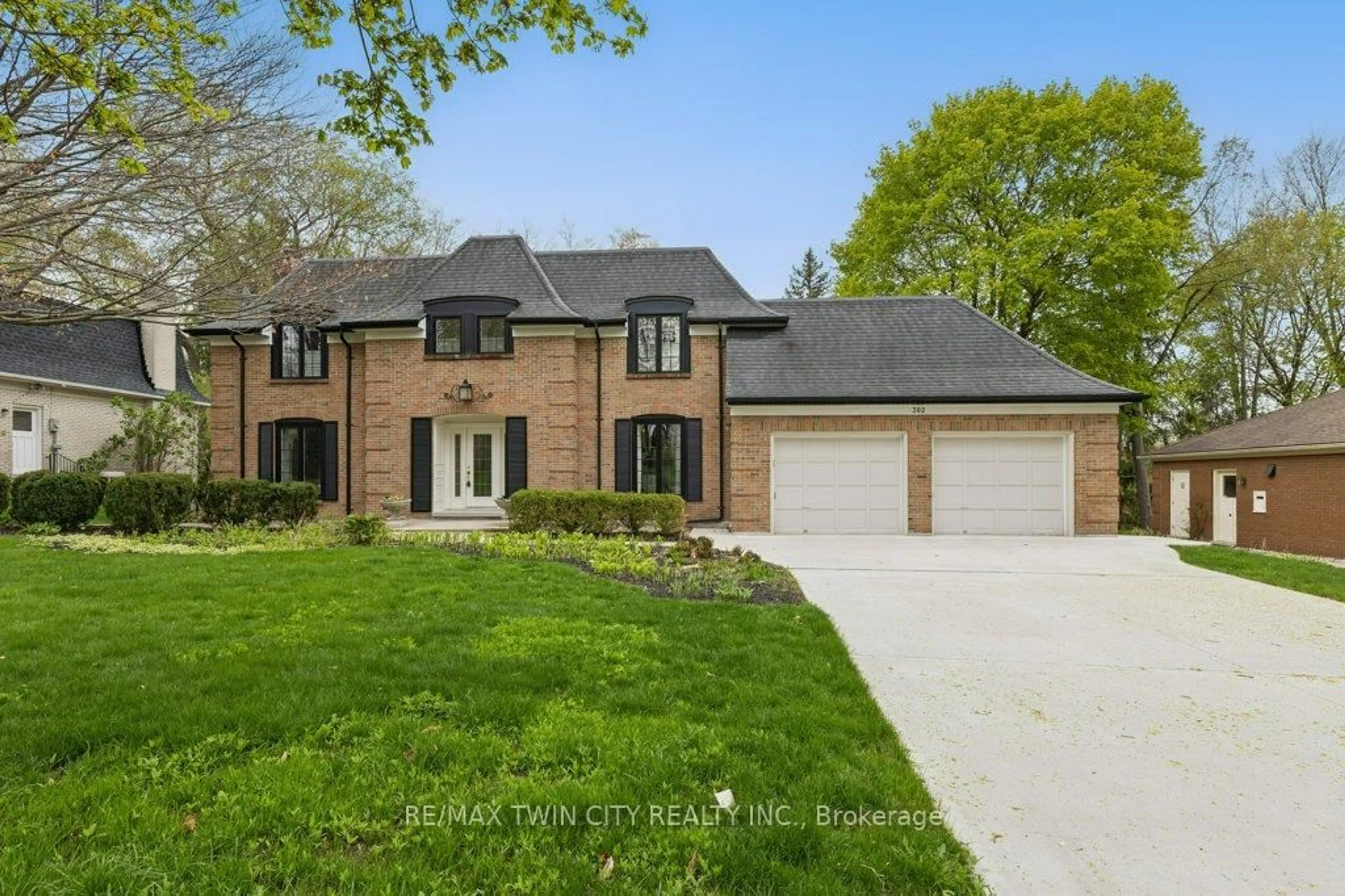 Home with brick exterior material, street for 302 Shakespeare Dr, Waterloo Ontario N2L 2V1