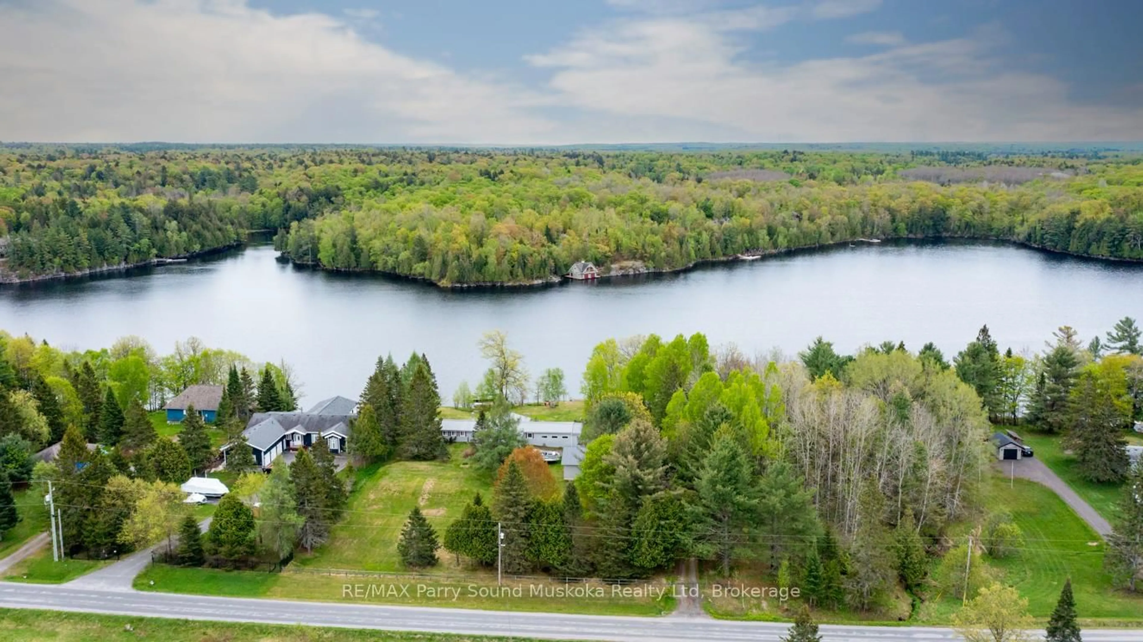 A pic from outside/outdoor area/front of a property/back of a property/a pic from drone, water/lake/river/ocean view for 28 Lakeside Dr, McKellar Ontario P2A 0B4
