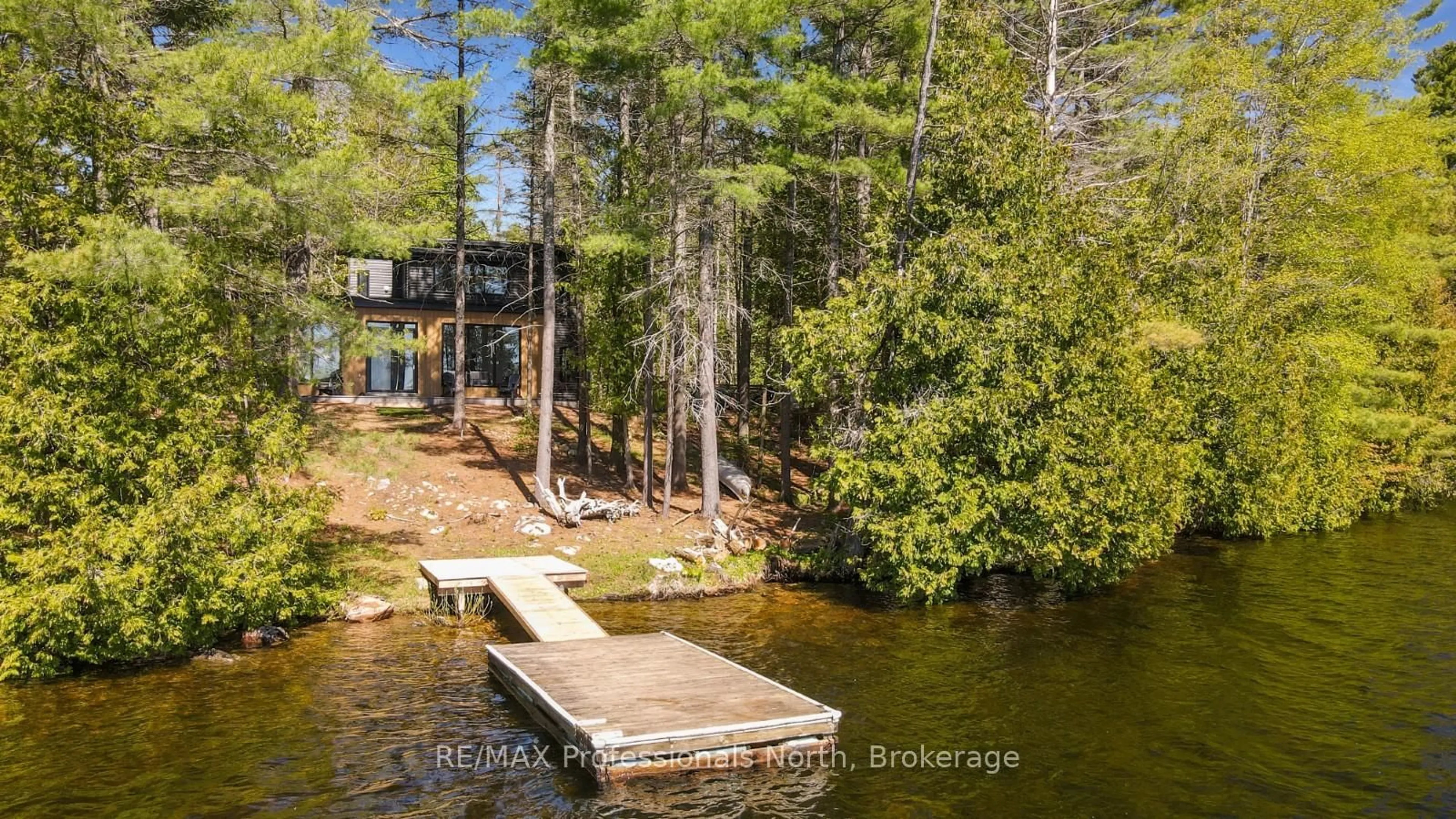 A pic from outside/outdoor area/front of a property/back of a property/a pic from drone, water/lake/river/ocean view for 1142 Turfyn Lane, Highlands East Ontario K0L 3C0