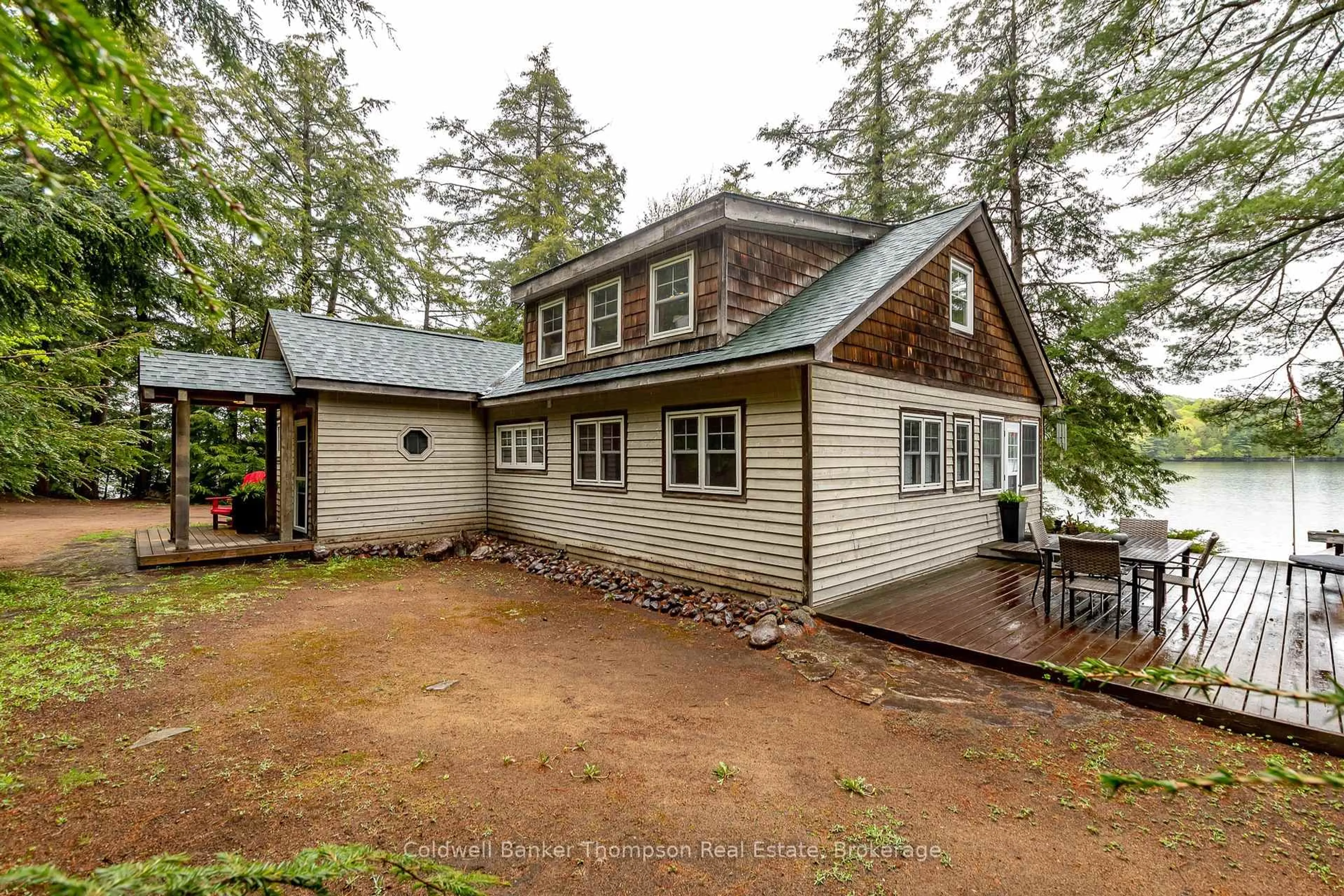 A pic from outside/outdoor area/front of a property/back of a property/a pic from drone, unknown for 309 West Waseosa Lake Rd, Huntsville Ontario P1H 2N5