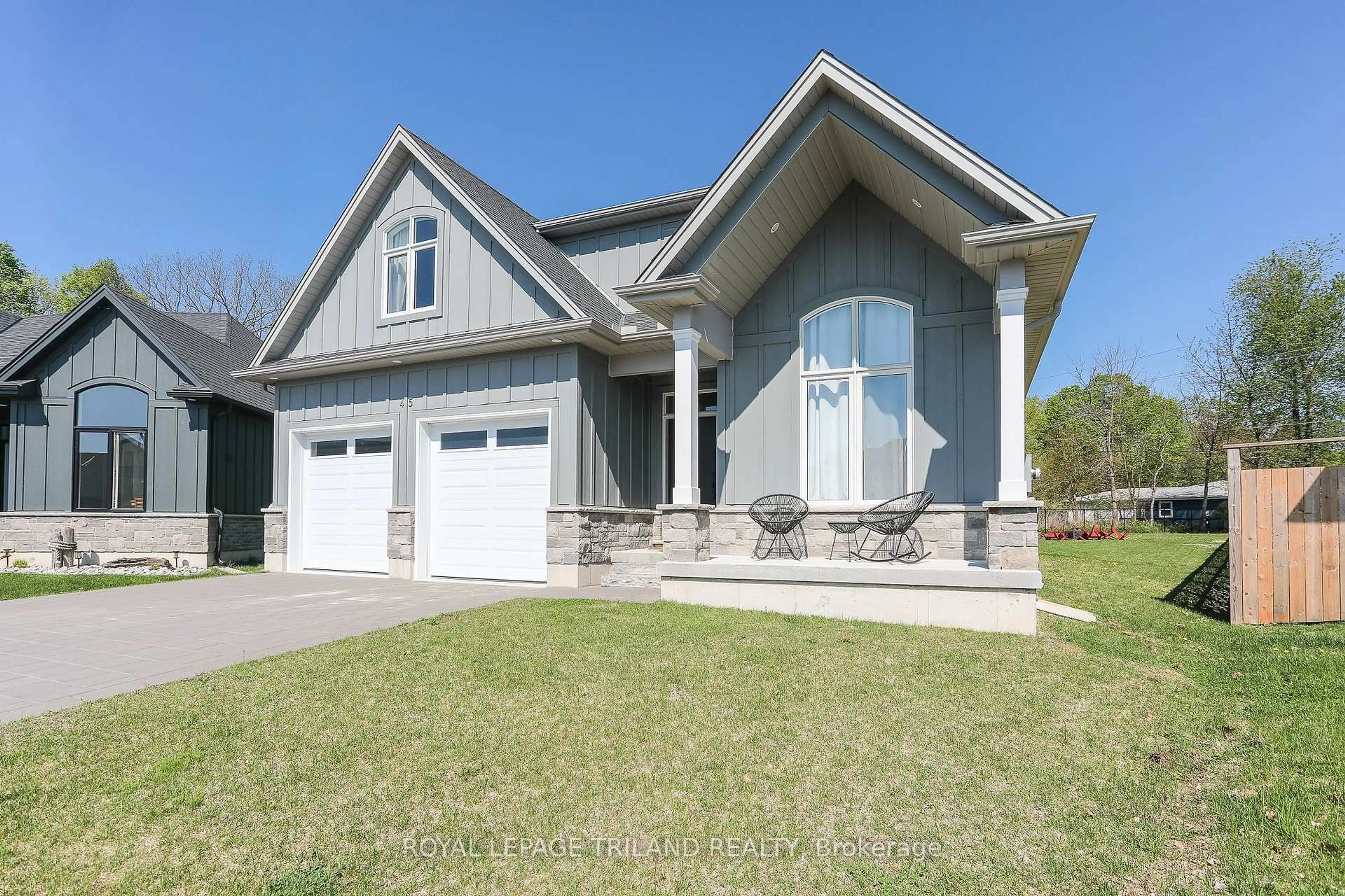Home with vinyl exterior material, street for 45 Compass Tr, Central Elgin Ontario N5L 0B4