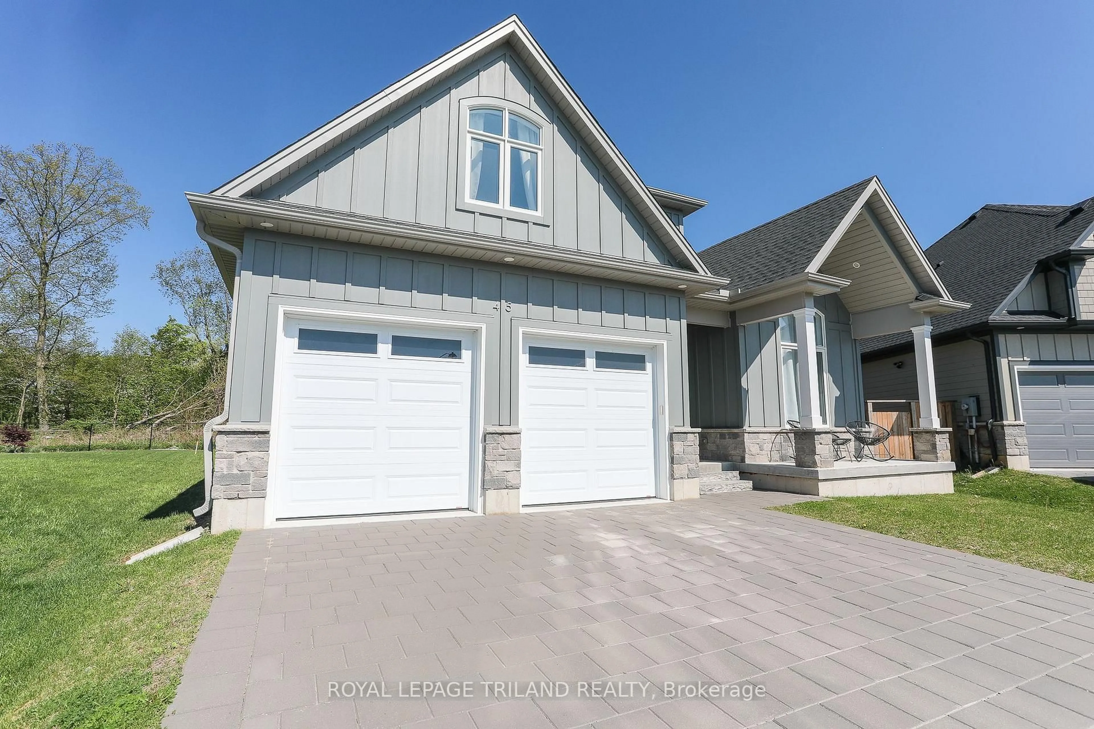 Home with vinyl exterior material, street for 45 Compass Tr, Central Elgin Ontario N5L 0B4