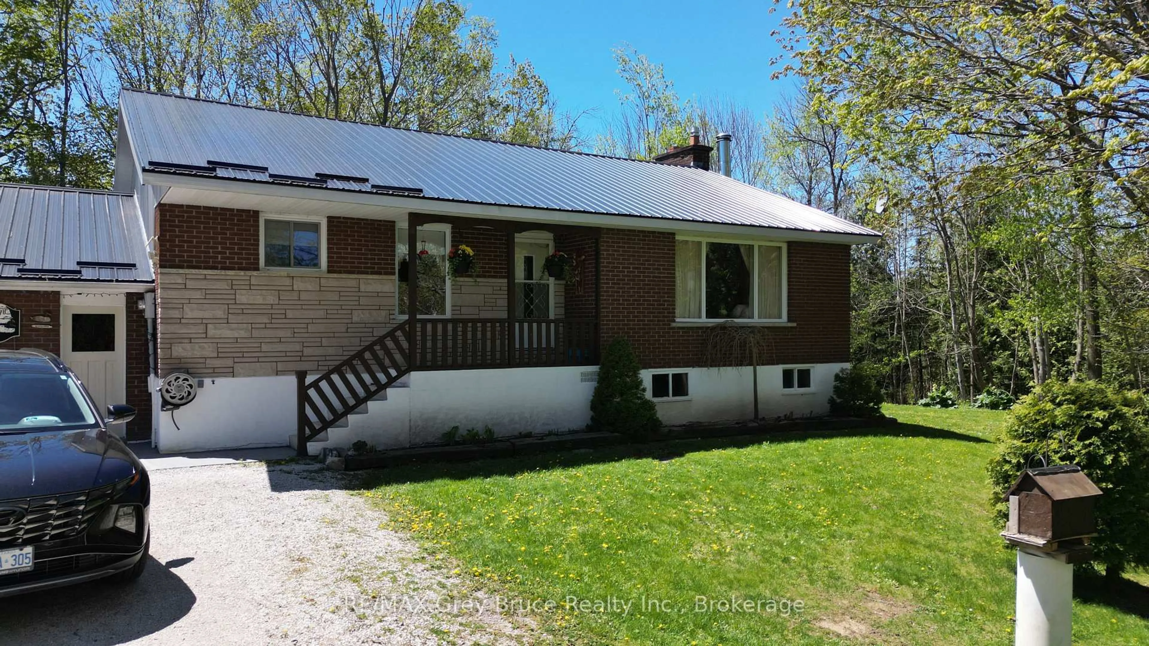 Home with vinyl exterior material, street for 3527 Highway 6, Northern Bruce Peninsula Ontario N0H 1W0