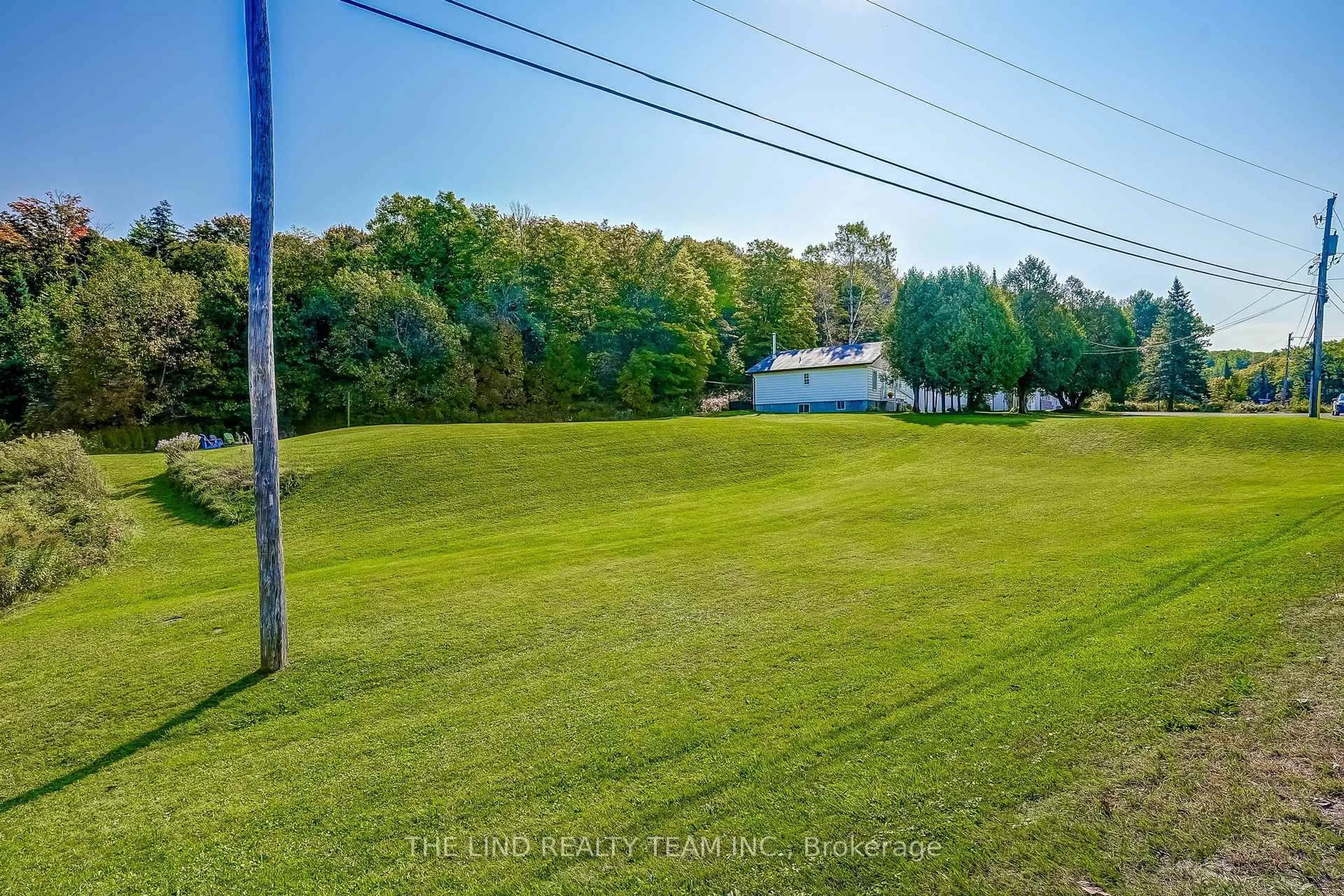A pic from outside/outdoor area/front of a property/back of a property/a pic from drone, water/lake/river/ocean view for 949 Raymond Rd, Muskoka Lakes Ontario P0B 1M0