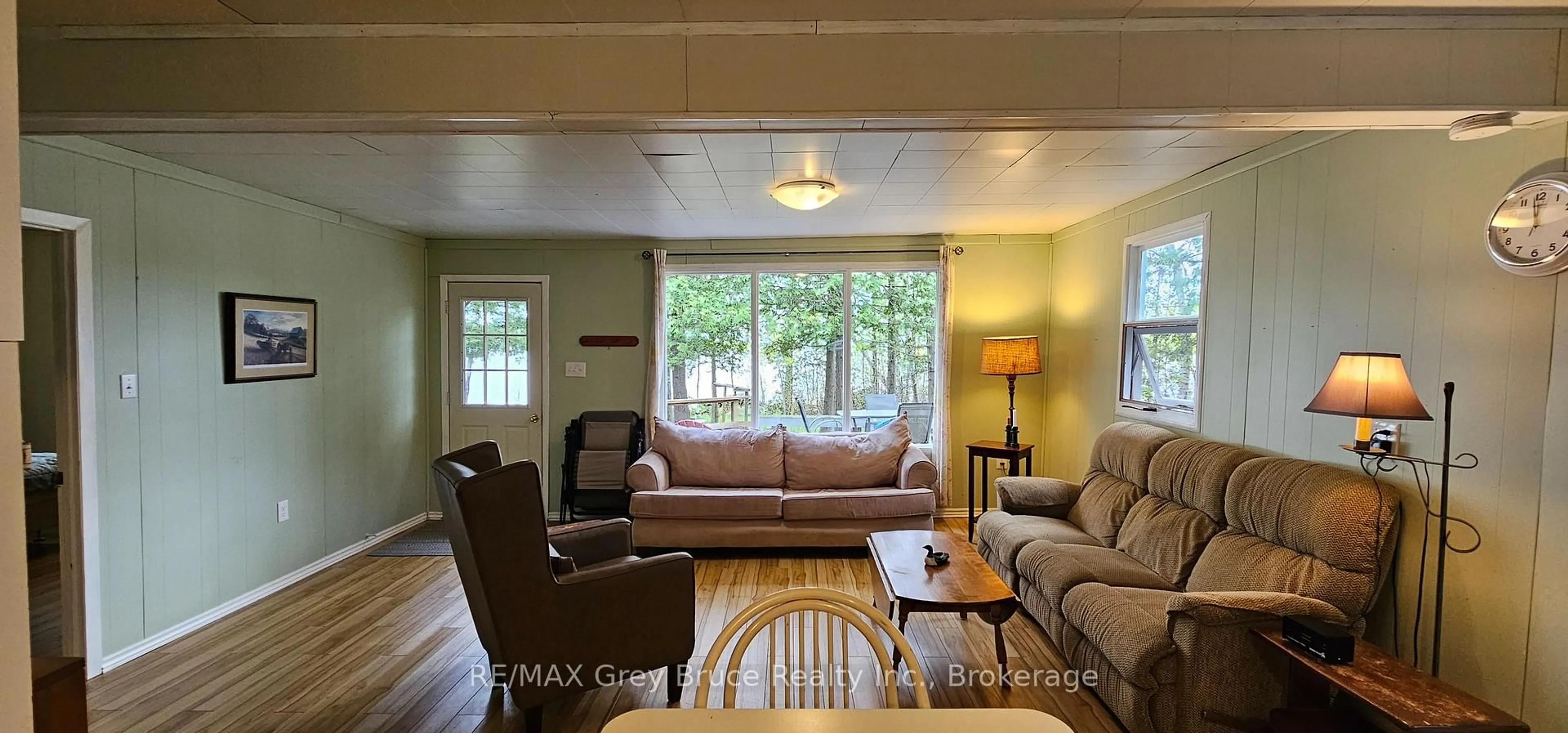Living room with furniture, wood/laminate floor for 282 Barney's Blvd, Northern Bruce Peninsula Ontario N0H 1Z0