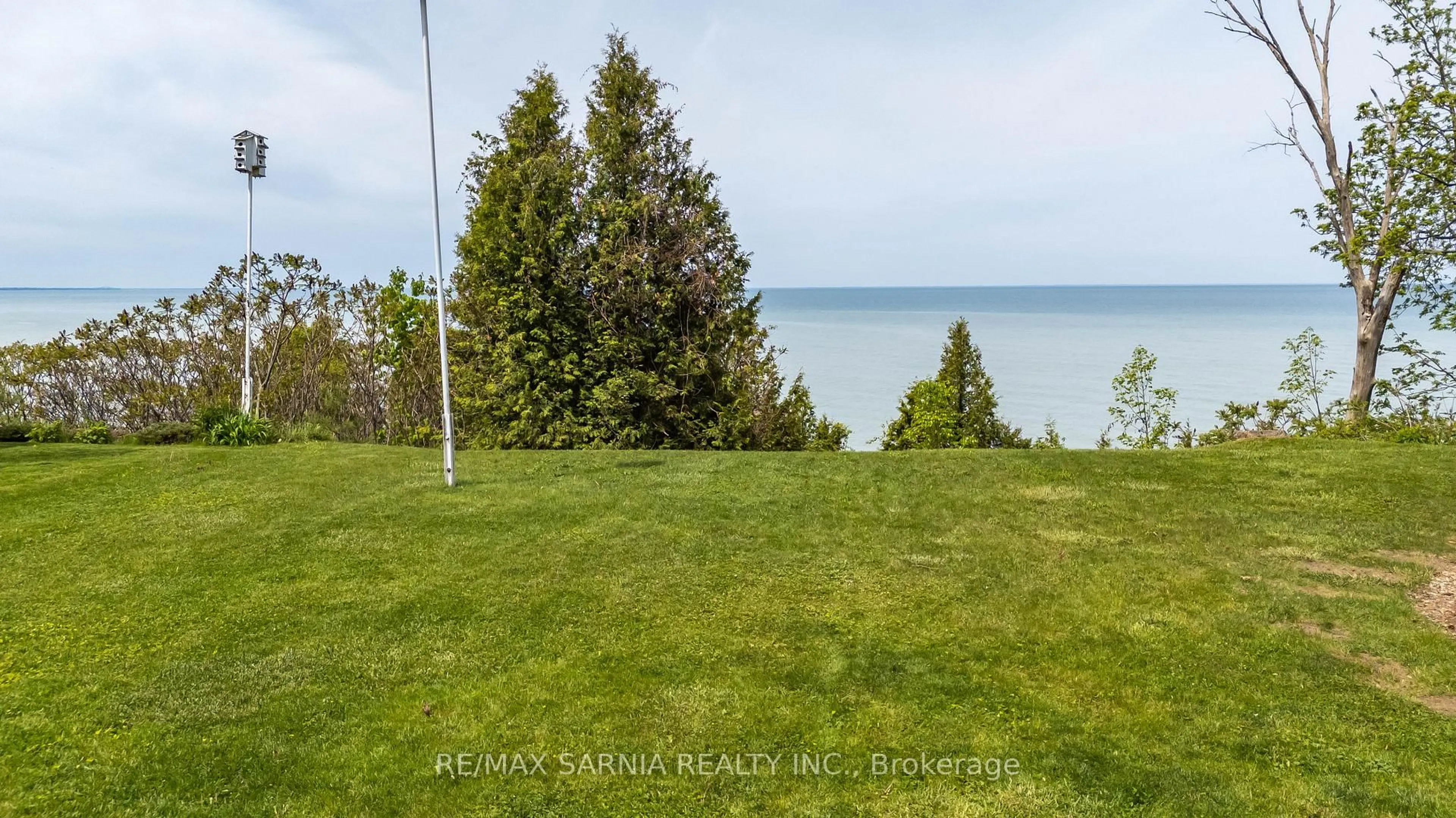 A pic from outside/outdoor area/front of a property/back of a property/a pic from drone, water/lake/river/ocean view for 4062 Bluepoint Dr, Plympton-Wyoming Ontario N0N 1J0
