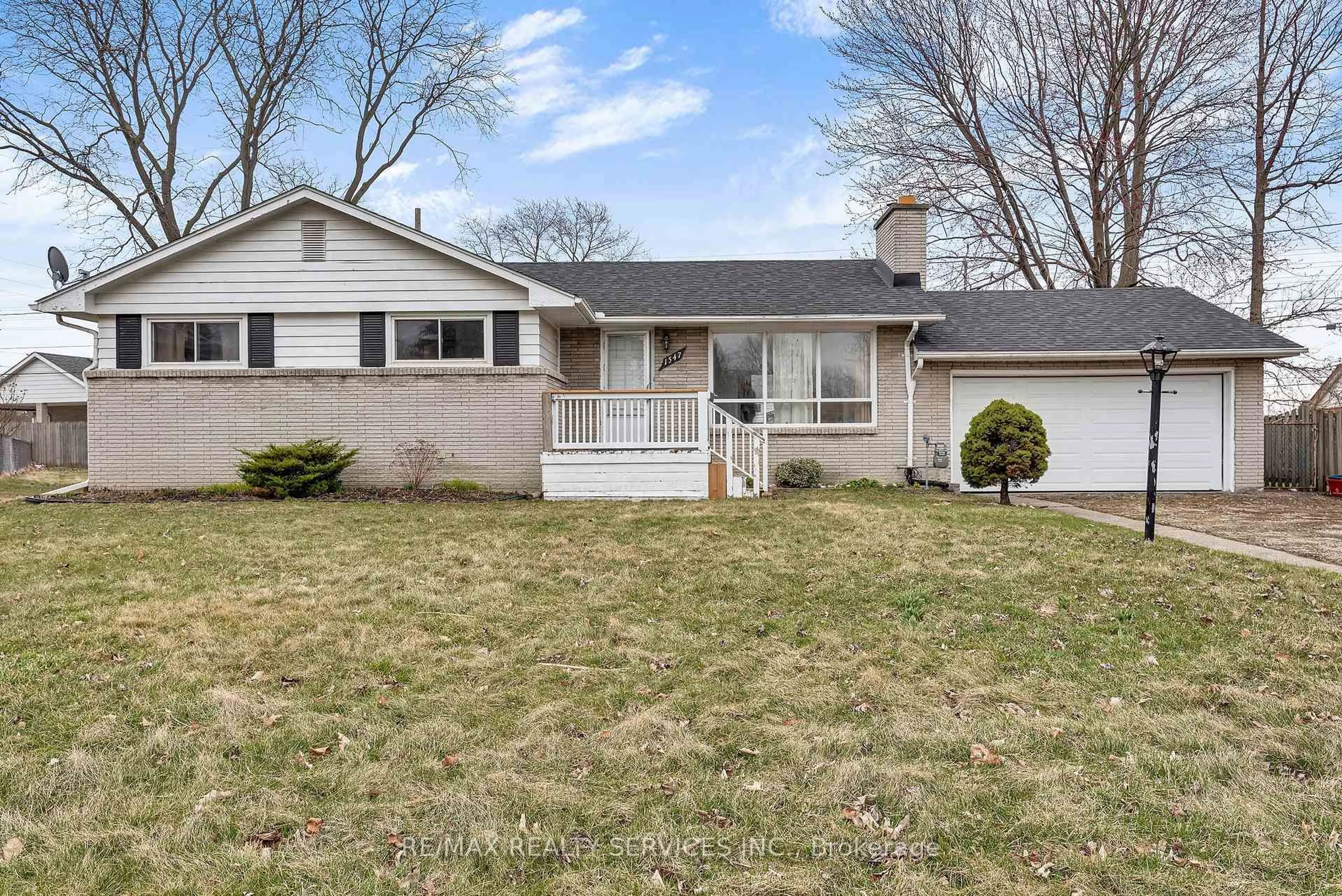 Home with vinyl exterior material, street for 1547 Cherrylawn Cres, Windsor Ontario N9E 1P3