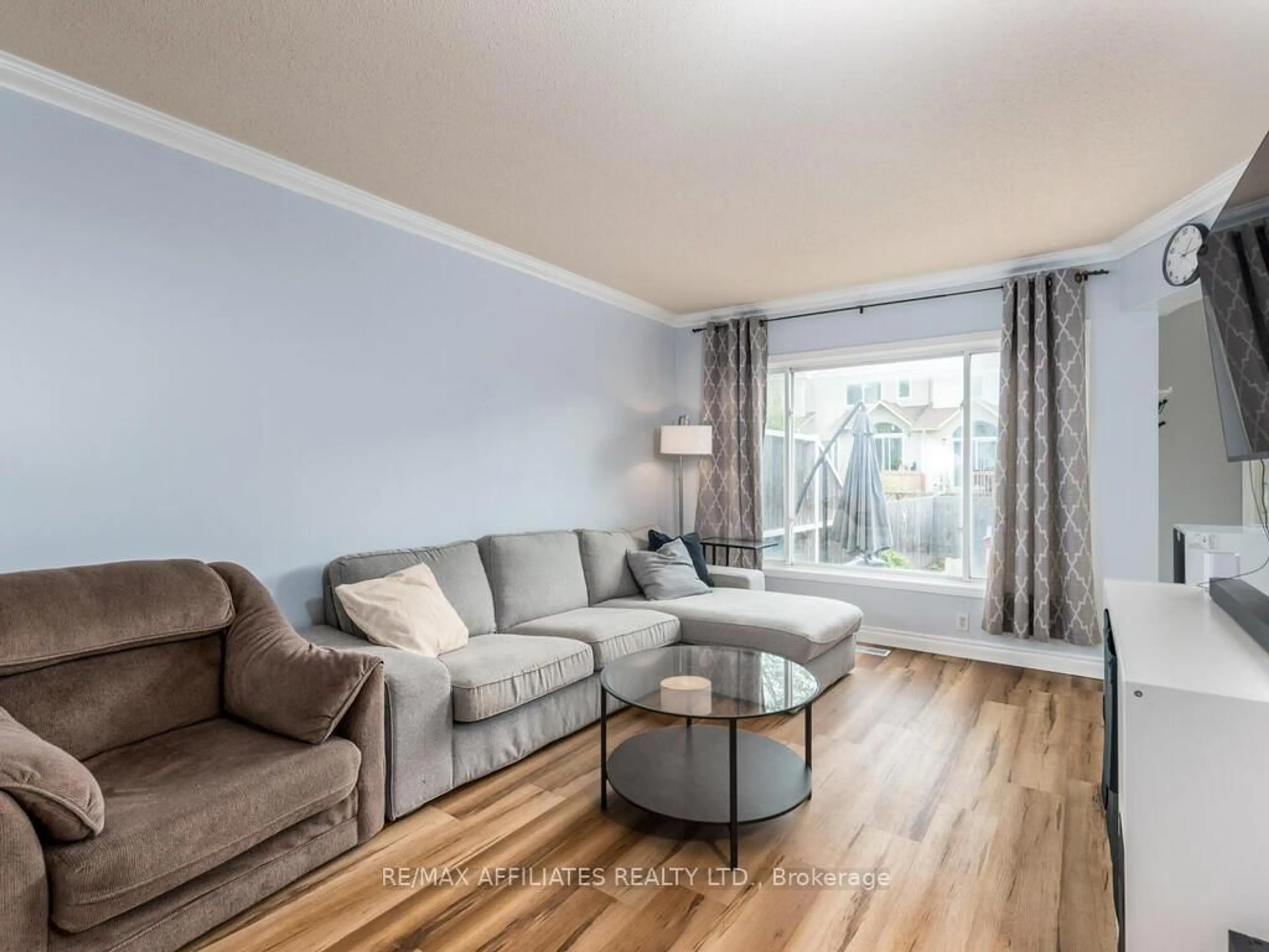 Living room with furniture, wood/laminate floor for 6 Eagleview St, Ottawa Ontario K2M 2R2